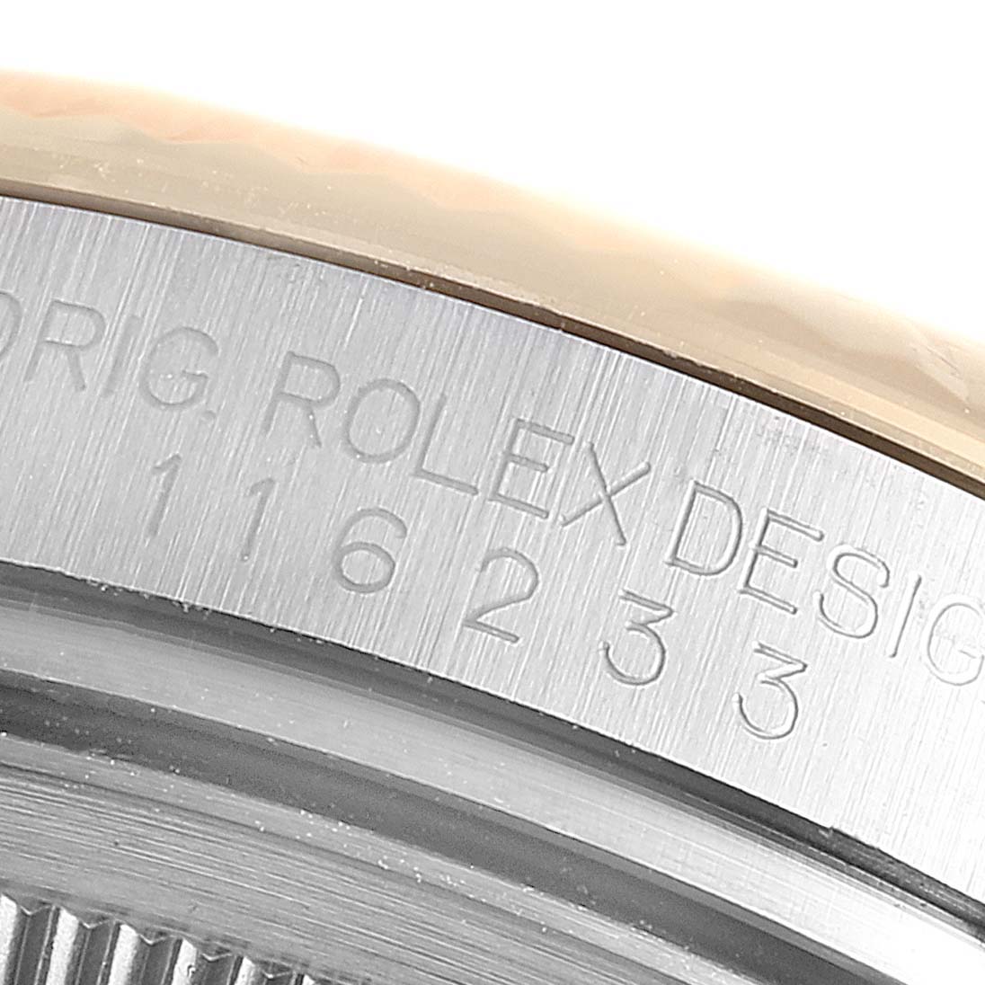 This close-up image shows the engraved bezel of a Rolex Datejust 116233 Men's Steel and Gold (two tone) Silver Dial 116233 Men's Steel and Gold (two tone) Silver Dial watch, highlighting the model number.