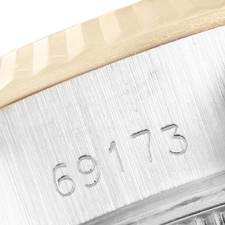 This close-up image of a Rolex Datejust 69173 Women's Steel and Gold (two tone) Champagne Dial 69173 Women's Steel and Gold (two tone) Champagne Dial watch shows the model number "69173" engraved on the case under the bezel.