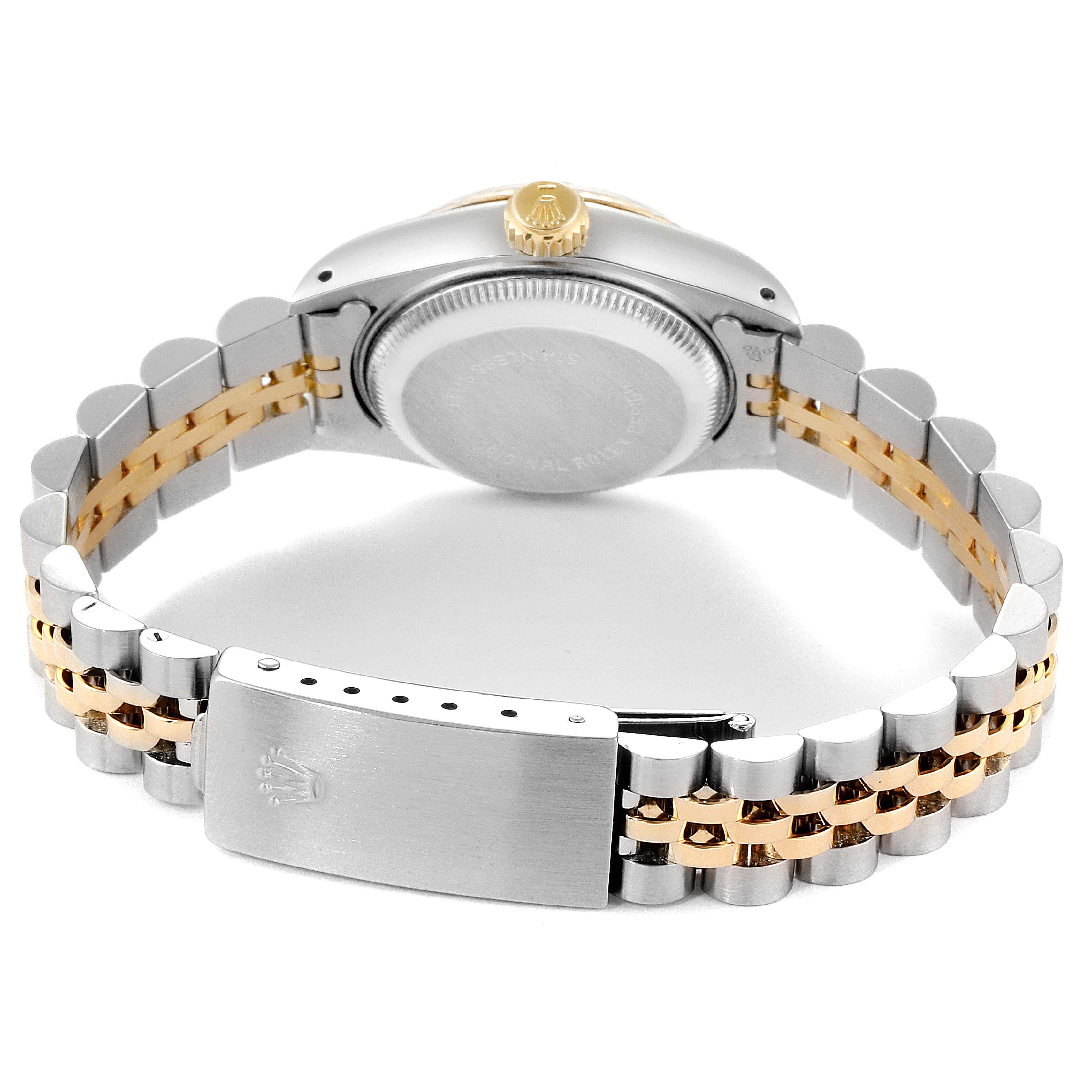 The image shows the back view of a Rolex Datejust 69173 Women
s Steel and Gold (two tone) Champagne Dial 69173 Women
s Steel and Gold (two tone) Champagne Dial watch, highlighting its clasp and two-tone bracelet.