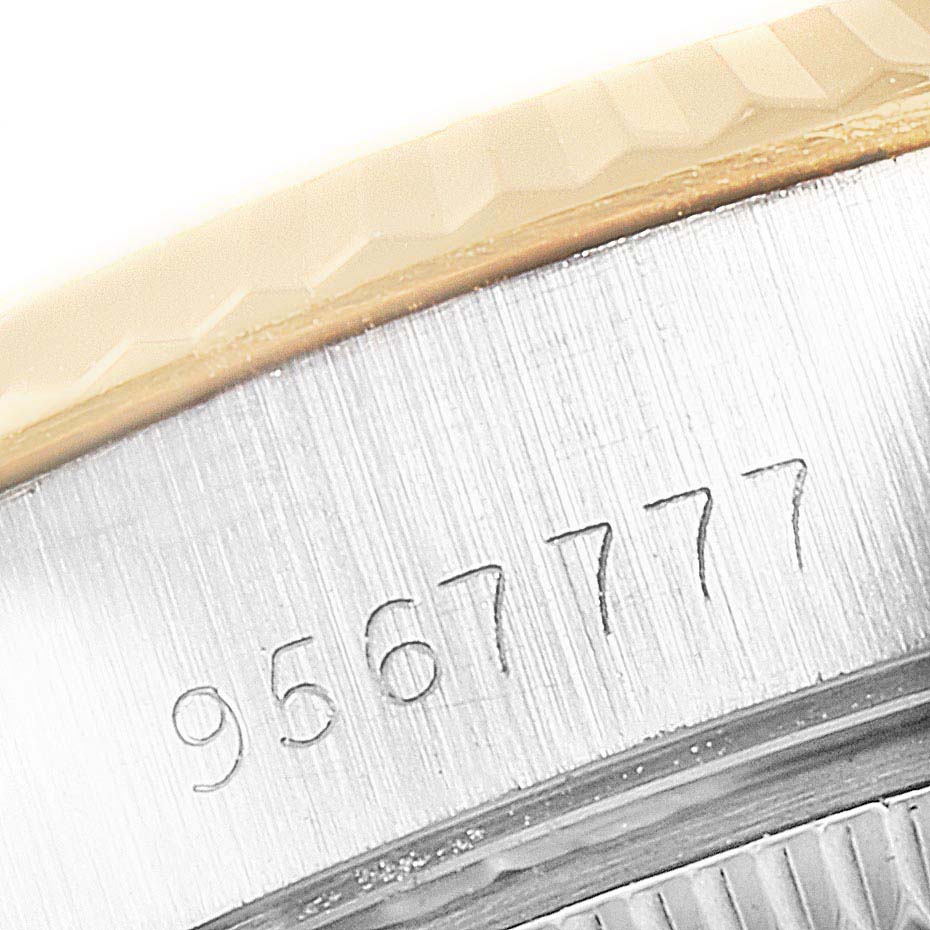 This close-up angle of the Rolex Datejust 69173 Women
s Steel and Gold (two tone) Champagne Dial 69173 Women
s Steel and Gold (two tone) Champagne Dial model showcases the watch
s serial number engraved on its side.