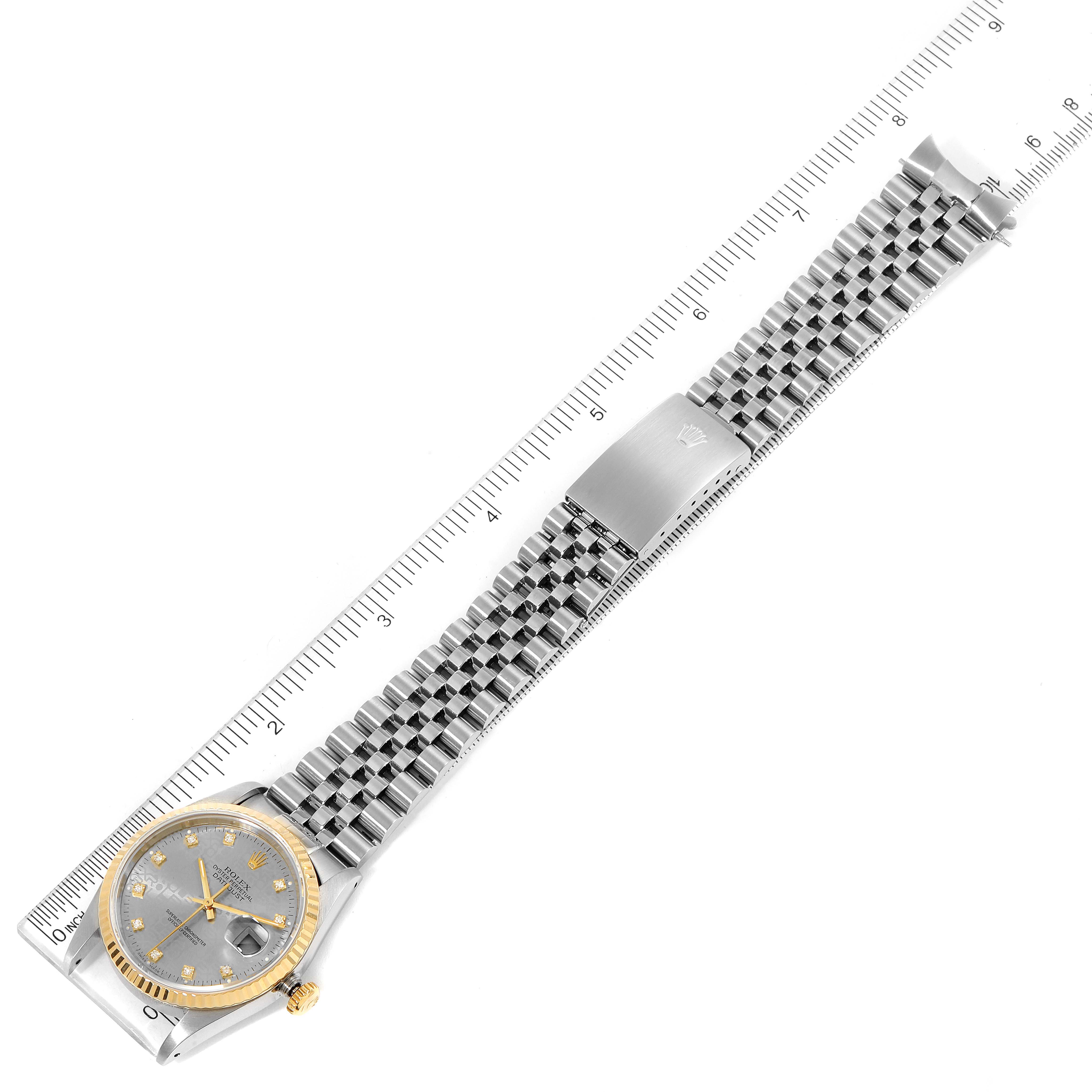 This Rolex Datejust 16233 Men
s Steel and Gold (two tone) Grey Dial 16233 Men
s Steel and Gold (two tone) Grey Dial watch is shown from a top-down angle, displaying the entire strap, bracelet, dial, and case.