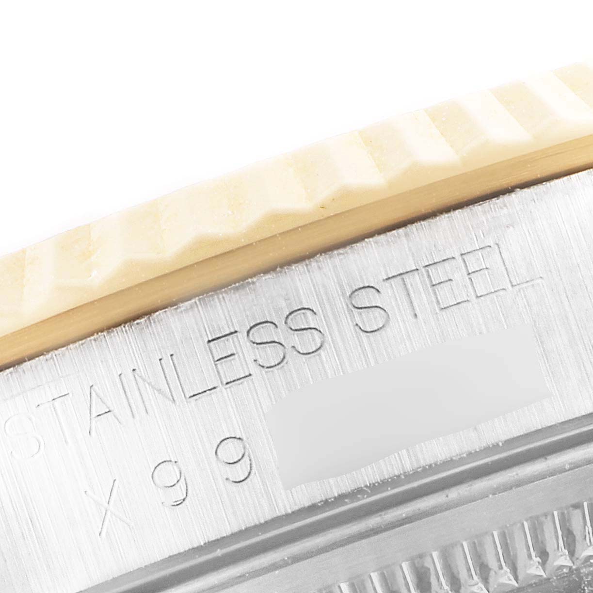 Close-up of the side view of a Rolex Datejust 16233 Men
s Steel and Gold (two tone) Grey Dial 16233 Men
s Steel and Gold (two tone) Grey Dial watch, showing the stainless steel casing and part of the bezel.