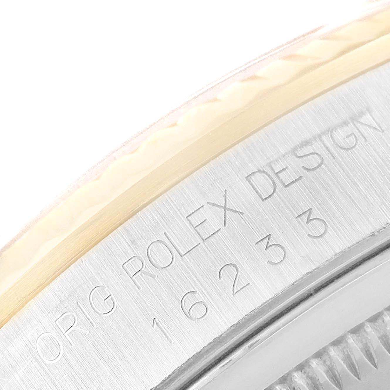 This image shows a close-up of the case side and bezel of a Rolex Datejust 16233 Men's Stainless Steel White Dial 16233 Men's Stainless Steel White Dial with engraved details.