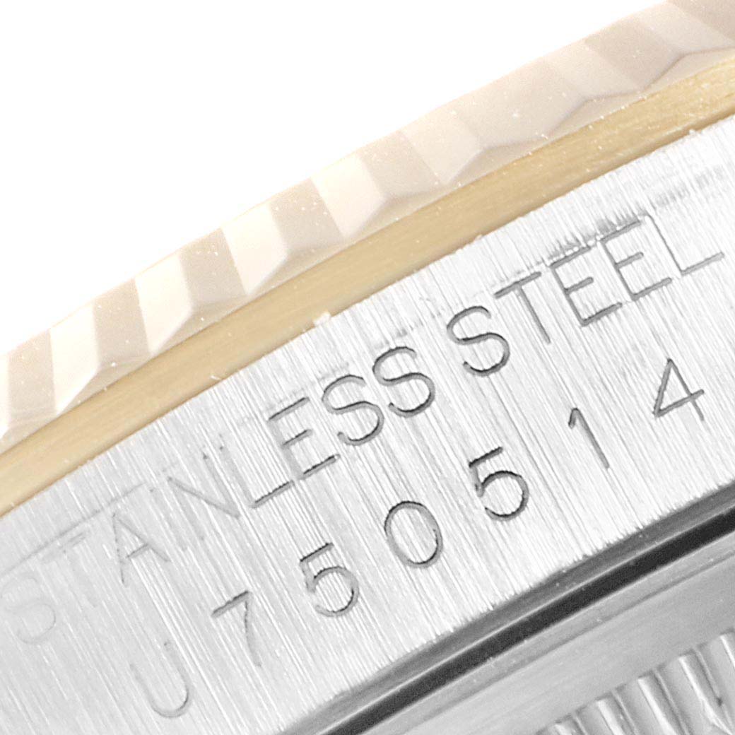 This image shows a close-up of the stainless steel and part of the fluted bezel of a Rolex Datejust 16233 Men's Stainless Steel White Dial 16233 Men's Stainless Steel White Dial watch.