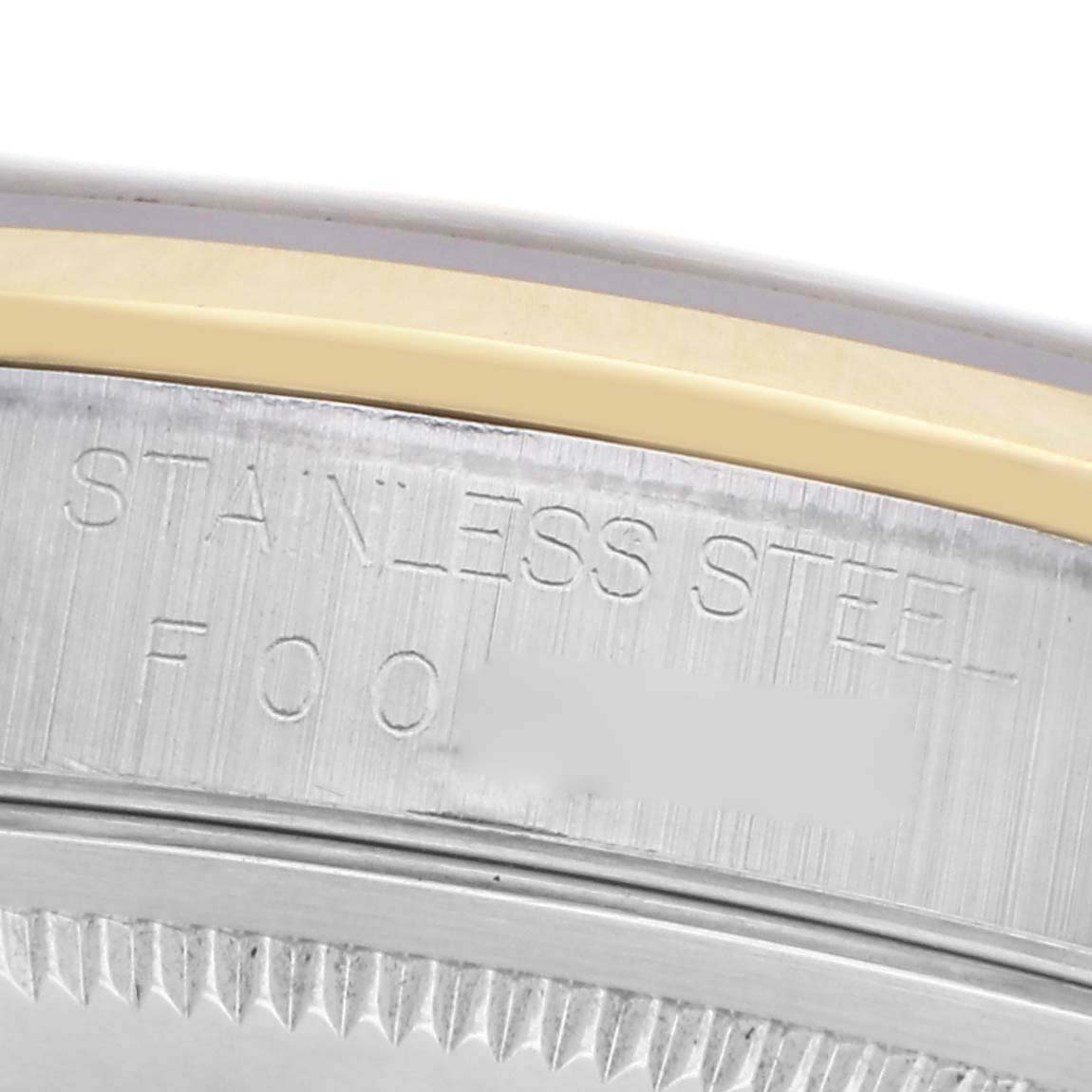 The image shows the side engraving of a Rolex Datejust 16203 Men's Steel and Gold (two tone) White Dial 16203 Men's Steel and Gold (two tone) White Dial's stainless steel case.