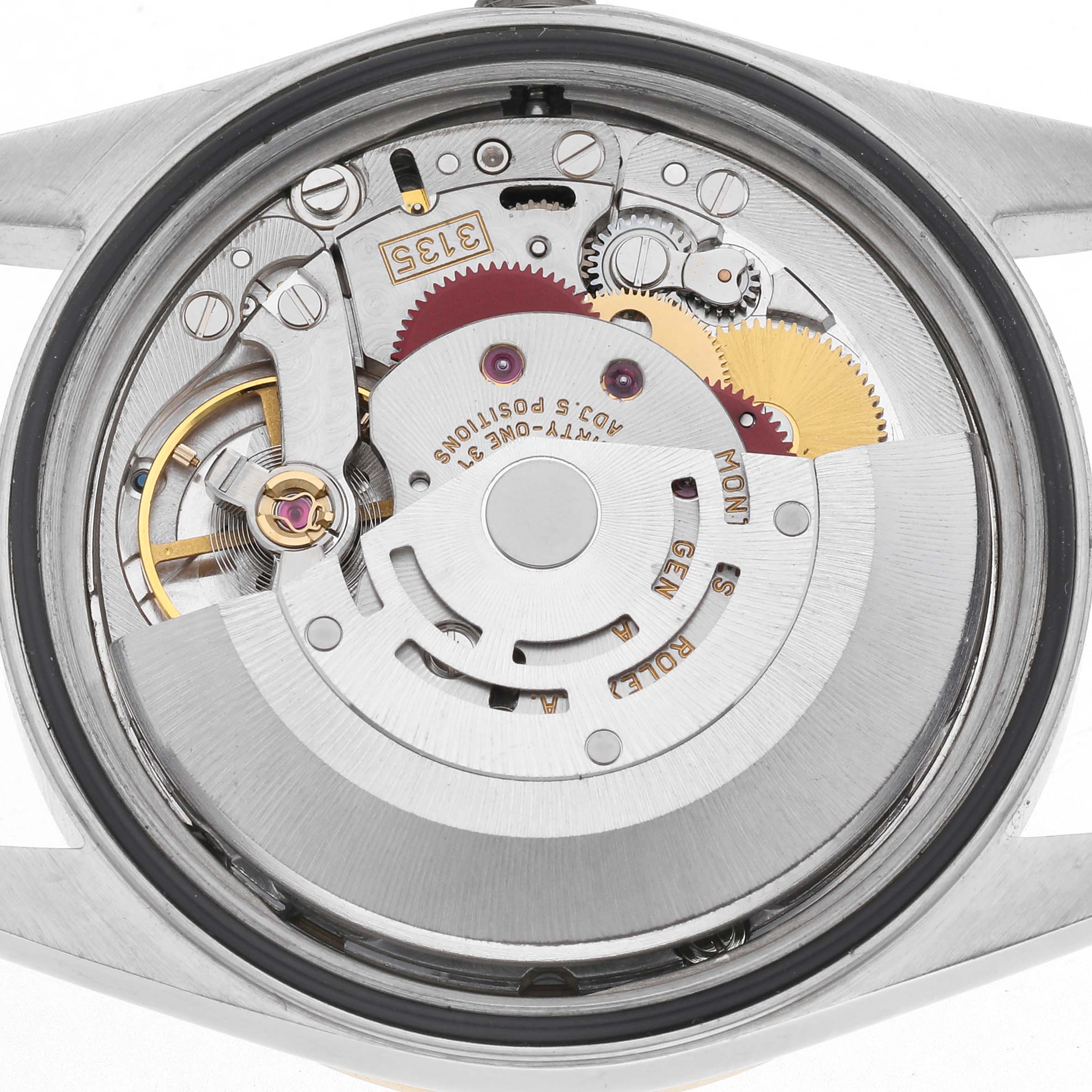 The image shows the Rolex Datejust 16203 Men's Steel and Gold (two tone) White Dial 16203 Men's Steel and Gold (two tone) White Dial movement from a back angle, highlighting gears and the rotor.