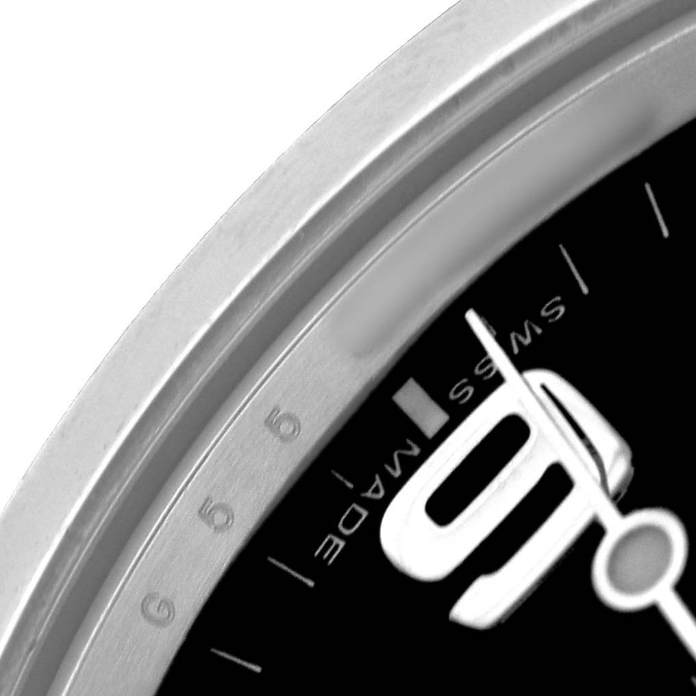 The image shows a close-up of the Rolex Explorer 214270 Men's Stainless Steel Black Dial watch's dial and bezel, focusing on the "SWISS MADE" detail near the 6 o'clock position.