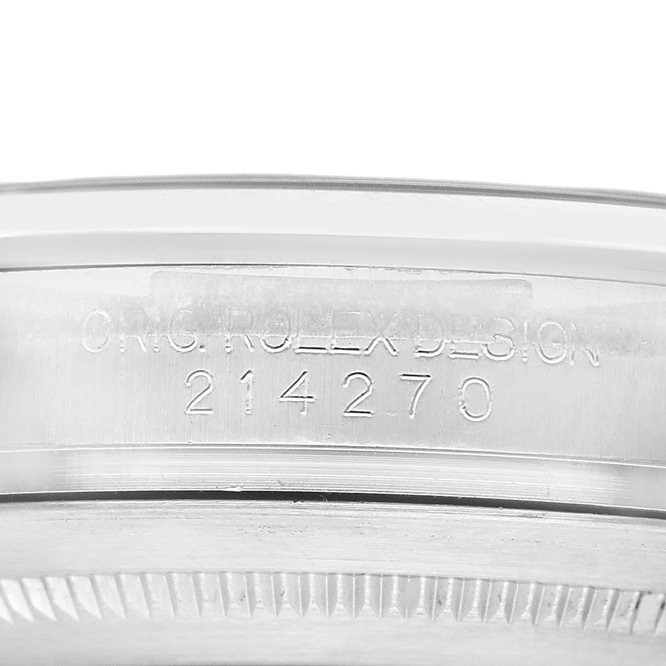 The image shows the side engraving of the Rolex Explorer 214270 Men's Stainless Steel Black Dial model, displaying "ORIG. ROLEX DESIGN" and the number 214270.