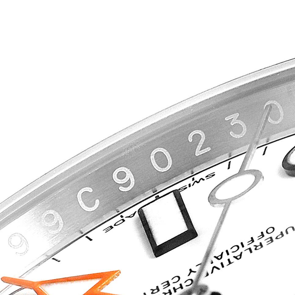 The image shows a close-up of the bezel, dial, and hands of a Rolex Explorer 216570 Men
s Stainless Steel White Dial 216570 Men
s Stainless Steel White Dial watch.