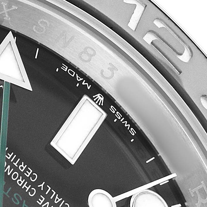 The image shows a close-up of the dial and bezel of a Rolex GMT-Master 126710 Men's Stainless Steel Black Dial watch, highlighting the markers and part of the hands.