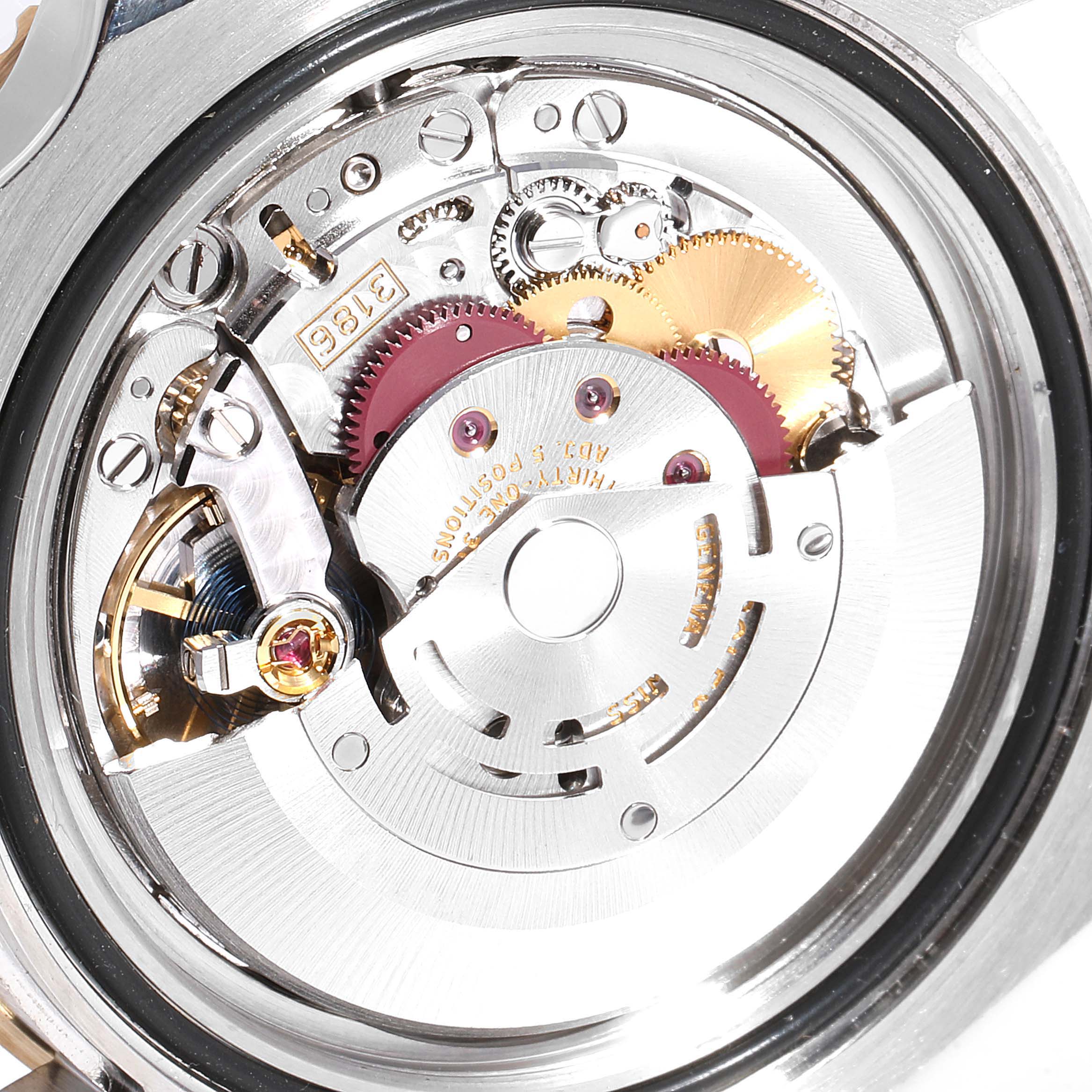 This is an inside view of the Rolex GMT-Master 116713 Men's Steel and Gold (two tone) Black Dial 116713 Men's Steel and Gold (two tone) Black Dial watch, showing its intricate movement mechanism and gears.