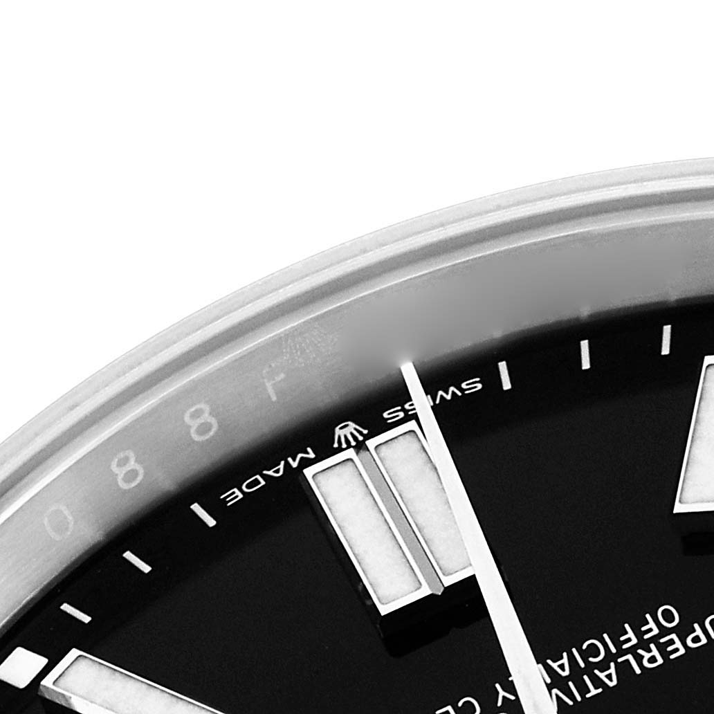 The image shows a close-up of the dial with hour markers and the "Swiss Made" inscription of a Rolex Oyster Perpetual 124300 Men's Stainless Steel Black Dial 124300 Men's Stainless Steel Black Dial watch.