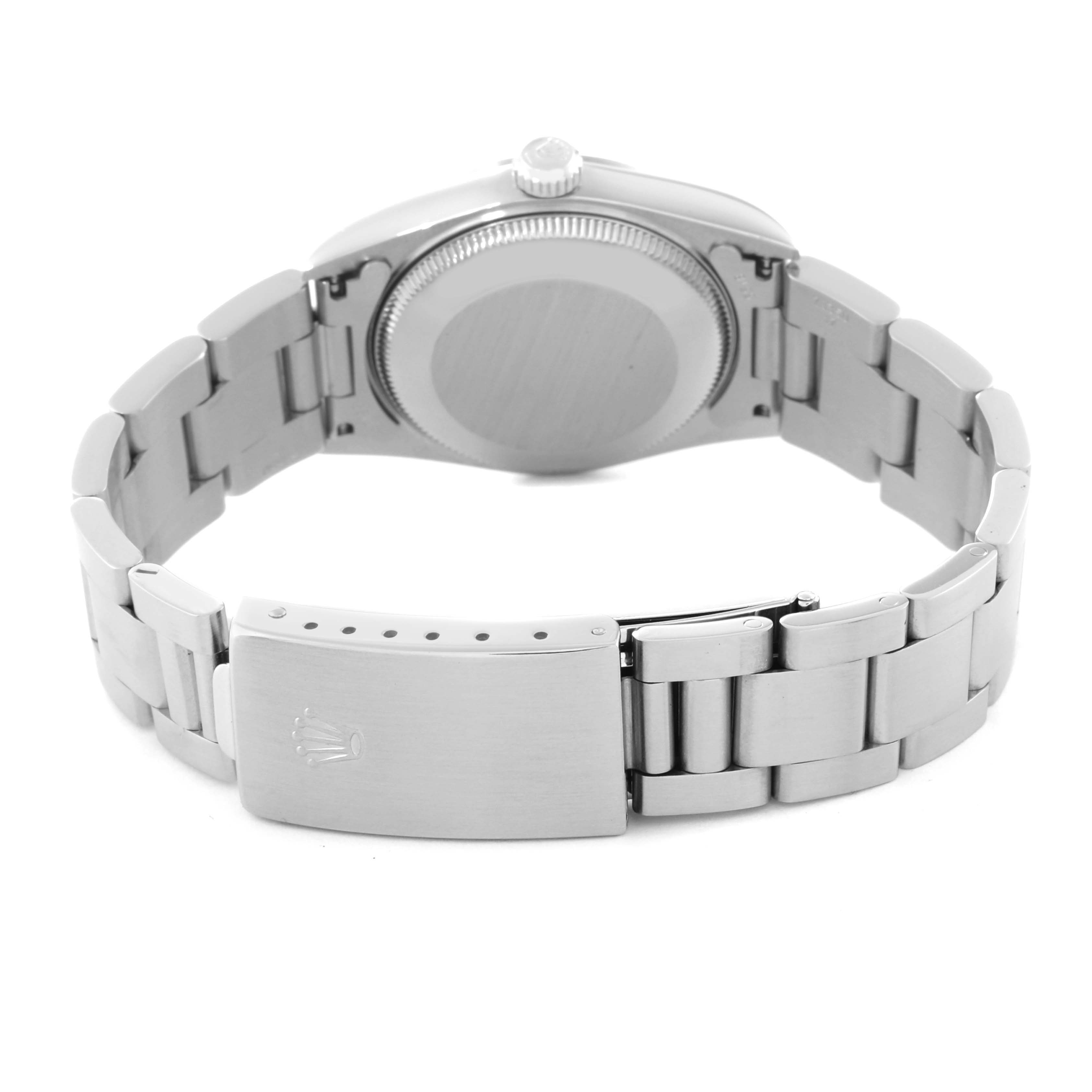 The image shows the back and clasp of a Rolex Mid-Size 77080 Women's Stainless Steel Orange Dial 77080 Women's Stainless Steel Orange Dial model watch from a rear angle.