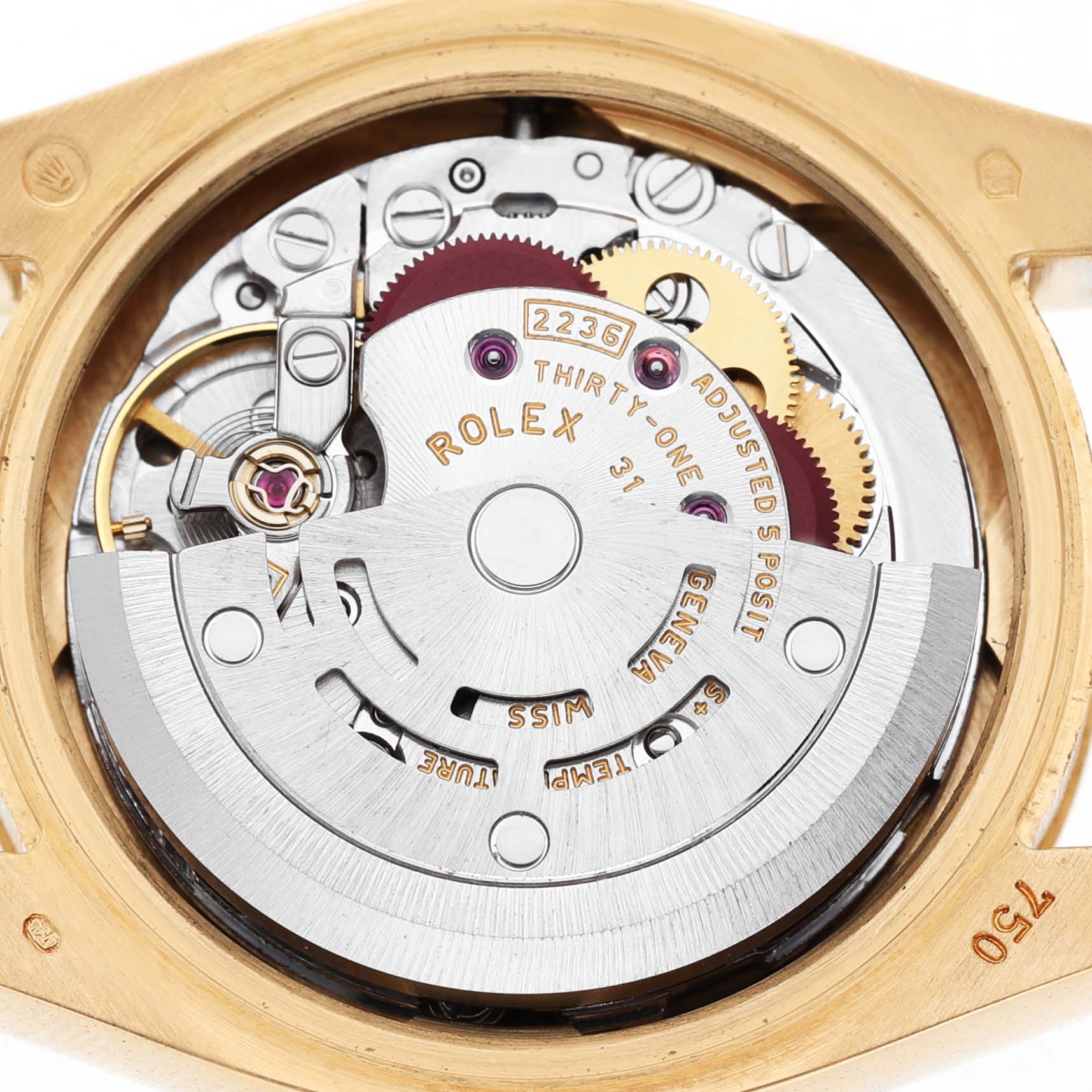 The image shows the movement of a Rolex President 179178 Women's Yellow Gold White Dial model viewed from the back, highlighting gears and the rotor.