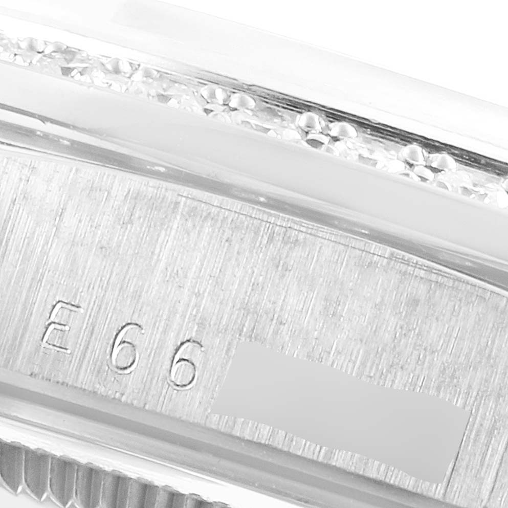 This image shows a close-up of the serial number engraving on the case of a Rolex President 18346 Men's Platinum Silver Dial 18346 Men's Platinum Silver Dial model watch.