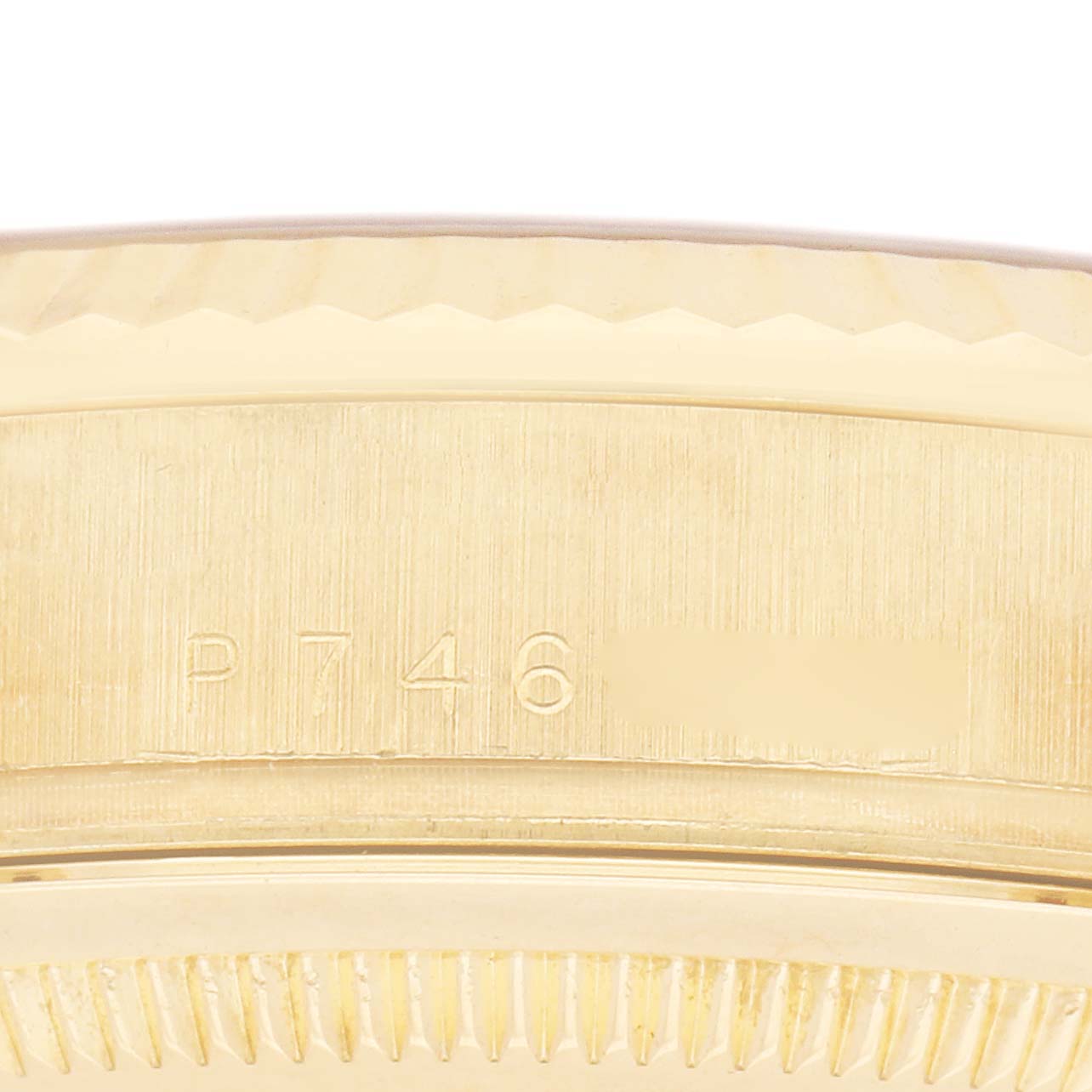 The image shows a close-up of the Rolex President 118238 Men's Yellow Gold Champagne Dial 118238 Men's Yellow Gold Champagne Dial model, highlighting the edge of the watch case with engraved markings.