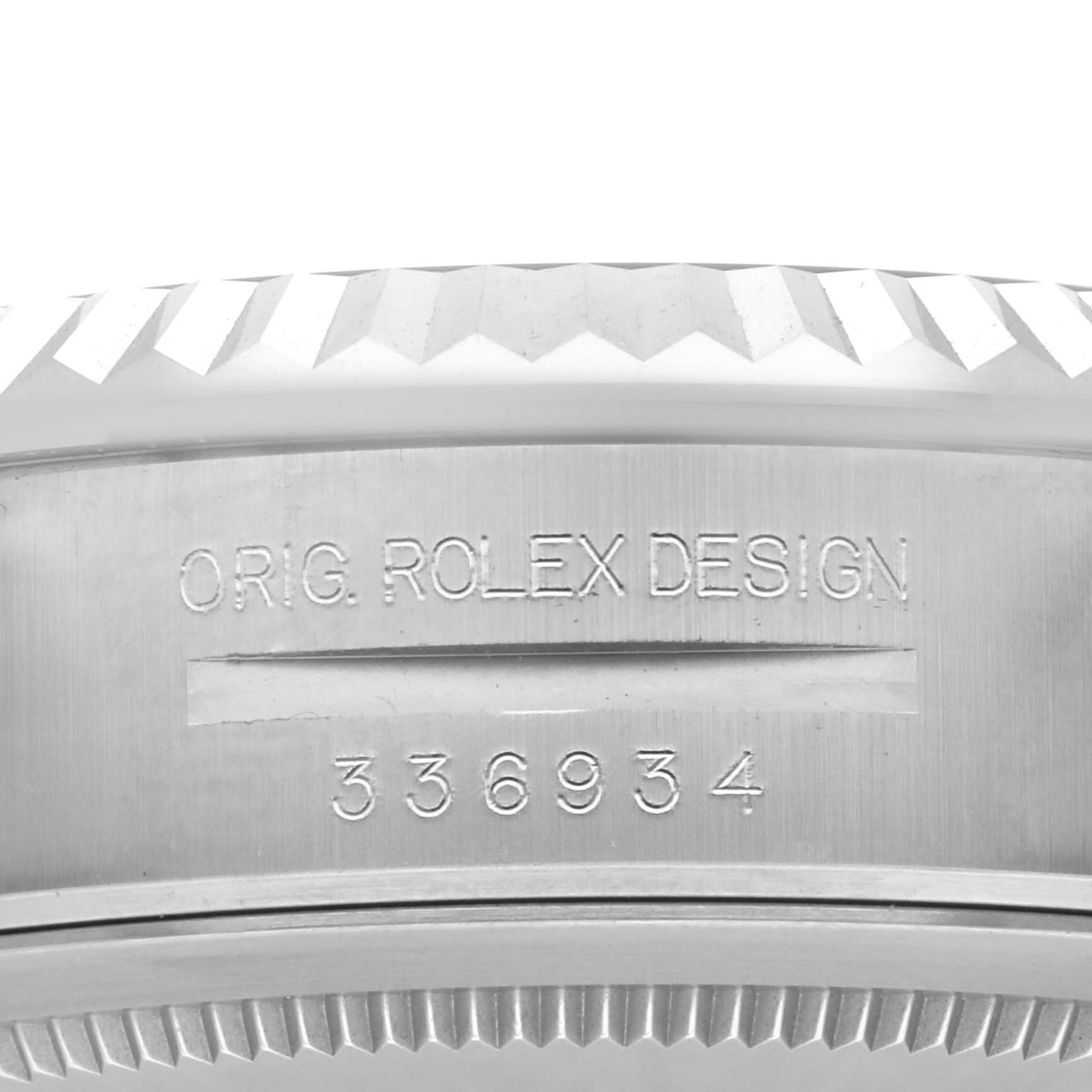 The image shows a close-up of the side of a Rolex Sky-Dweller 336934 Men's Stainless Steel Blue Dial 336934 Men's Stainless Steel Blue Dial, highlighting the "Orig. Rolex Design" and a serial number.