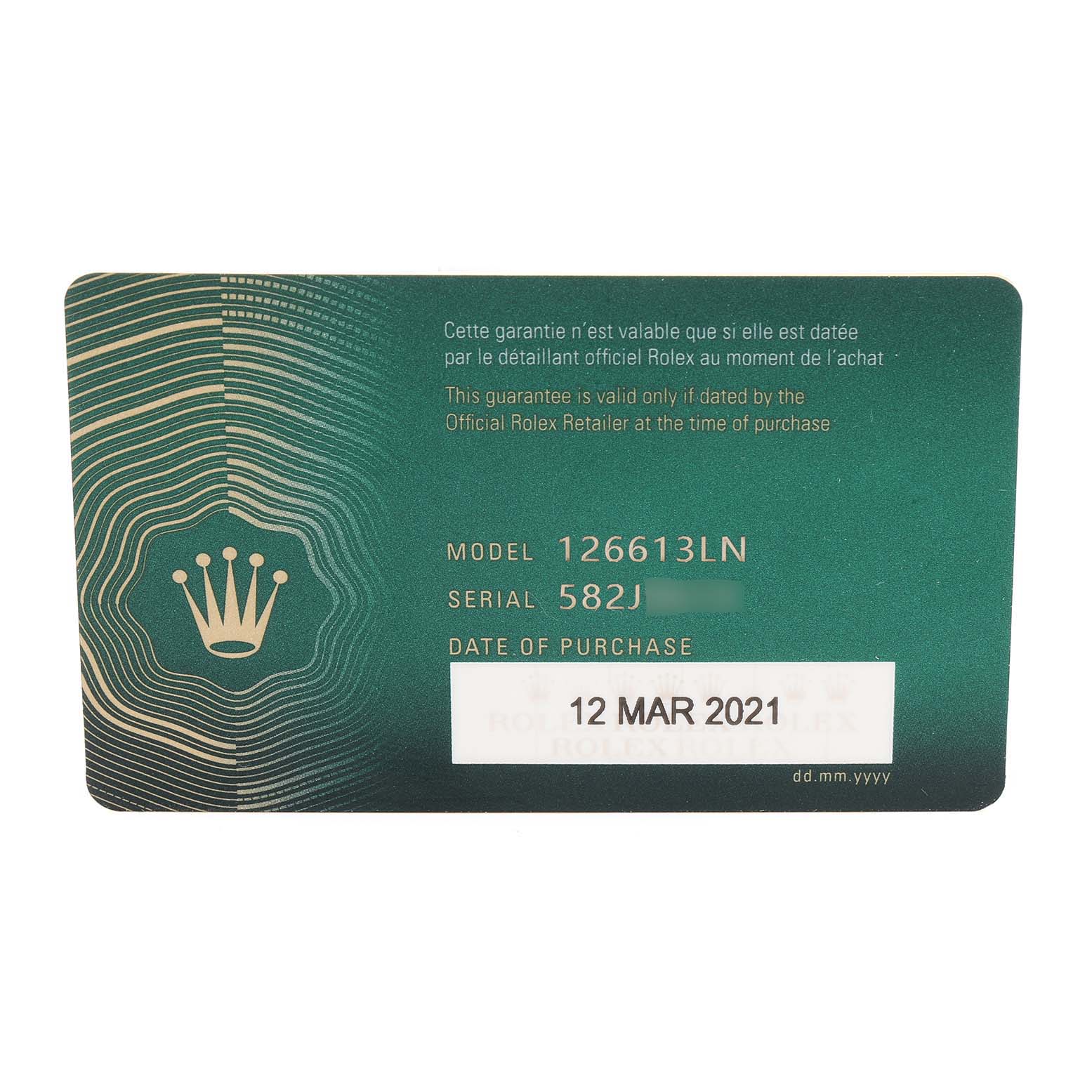 This image shows the warranty card for a Rolex Submariner 126613 Men
s Steel and Gold (two tone) Black Dial 126613 Men
s Steel and Gold (two tone) Black Dial model 126613LN, featuring the date of purchase and serial number.