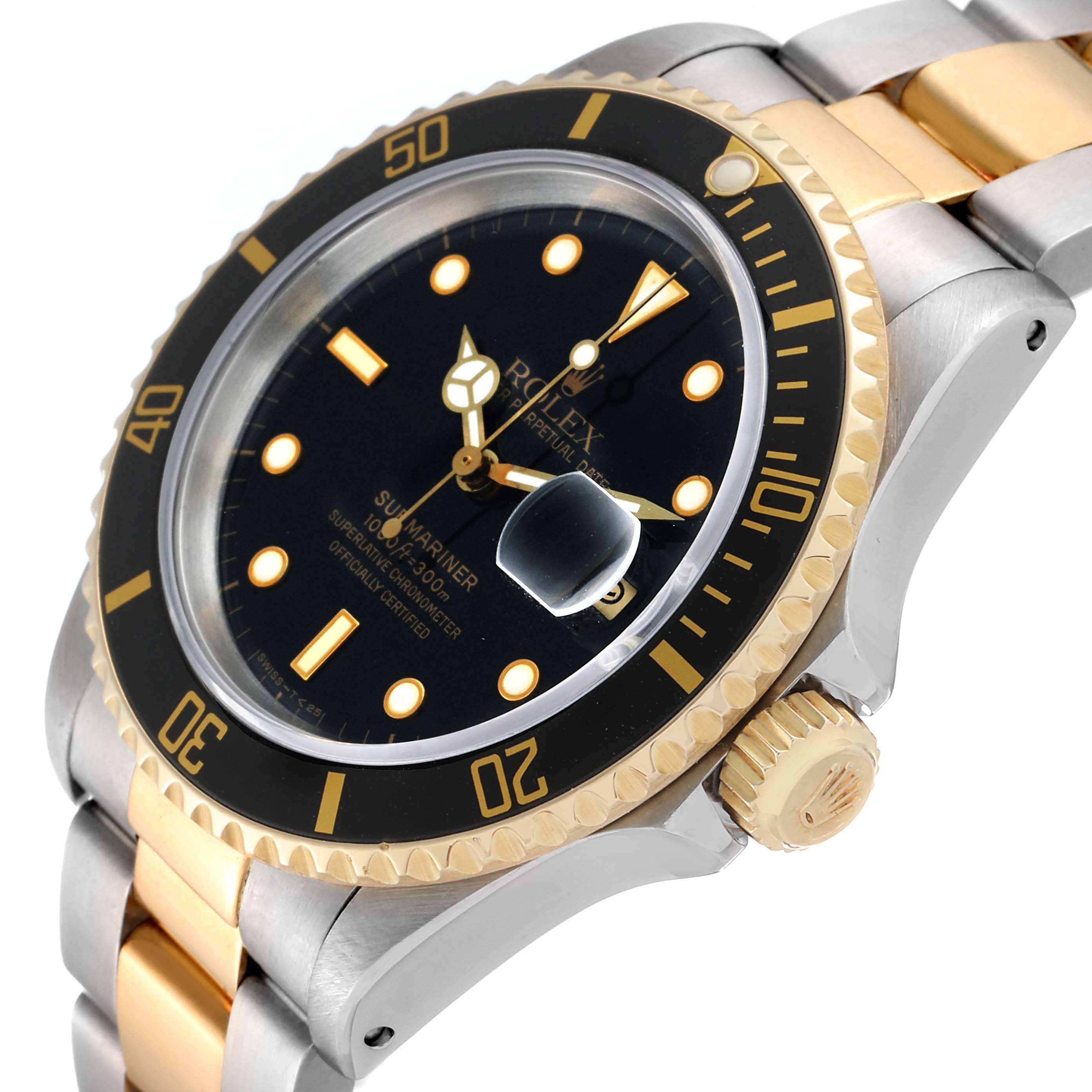 The image shows a close-up angle of the Rolex Submariner 16613 Men's Steel and Gold (two tone) Black Dial 16613 Men's Steel and Gold (two tone) Black Dial watch, highlighting its bezel, dial, and part of the two-tone bracelet.
