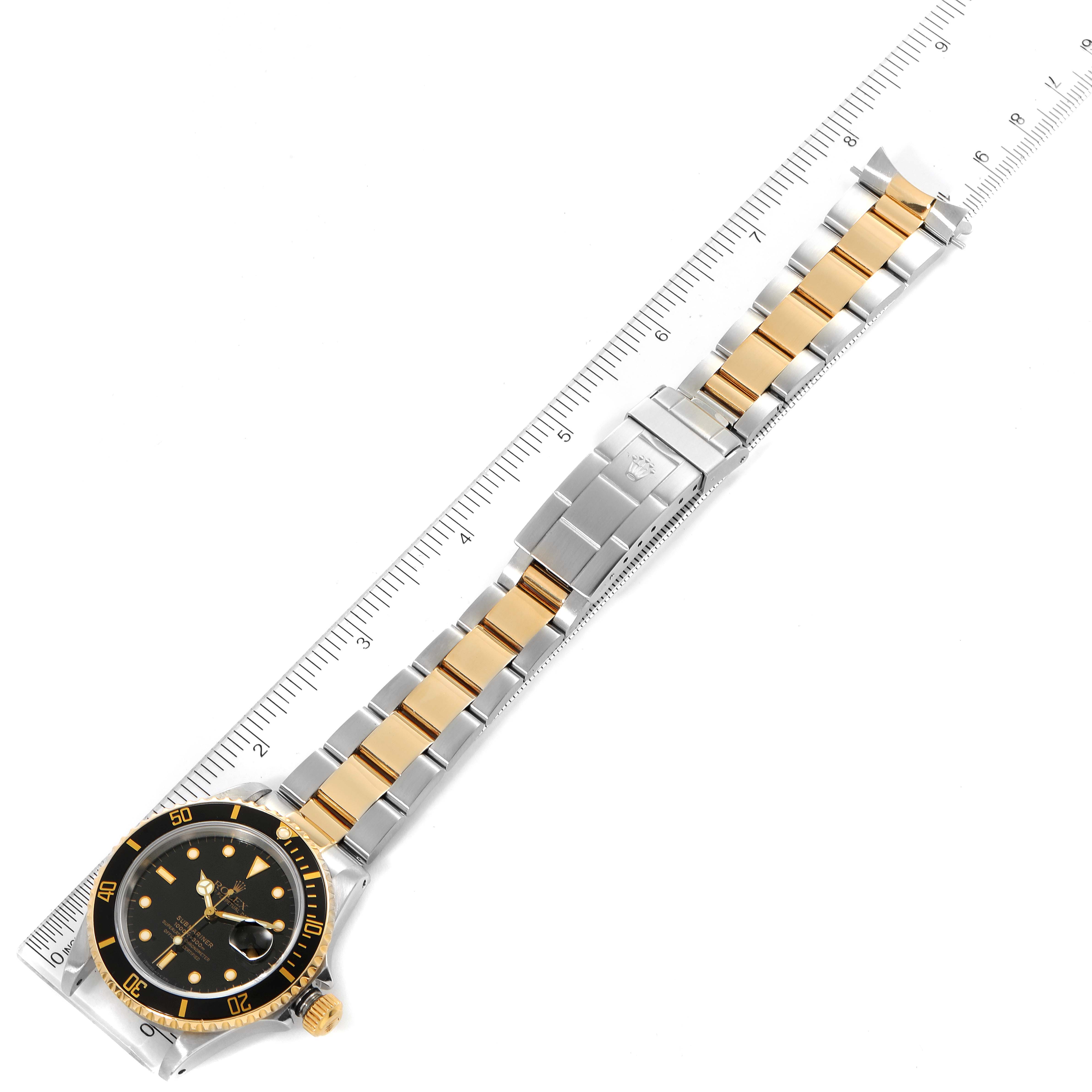 This image shows the front view of the Rolex Submariner 16613 Men's Steel and Gold (two tone) Black Dial 16613 Men's Steel and Gold (two tone) Black Dial watch, displaying its dial, bezel, and two-tone metal bracelet.