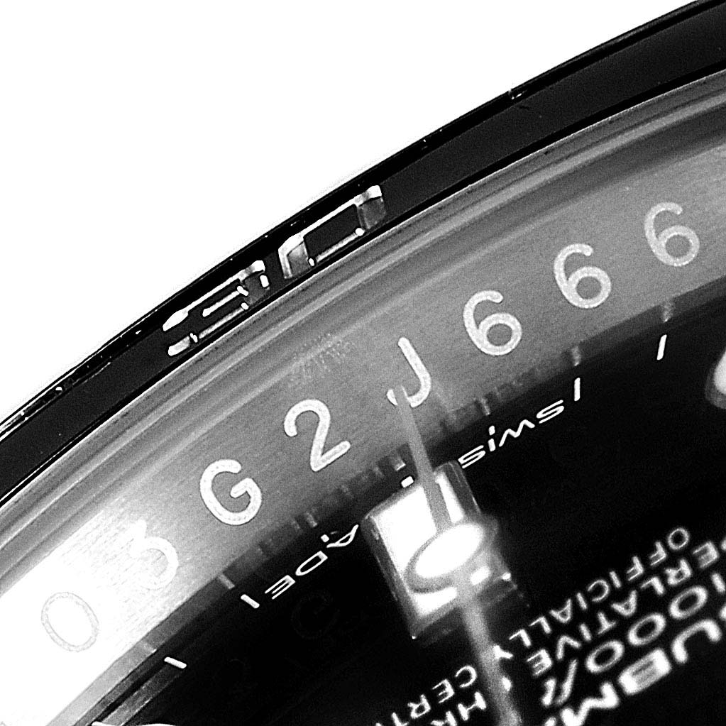 This zoomed-in image showcases the bezel and part of the dial of the Rolex Submariner 114060 Men
s Stainless Steel Black Dial 114060 Men
s Stainless Steel Black Dial watch.