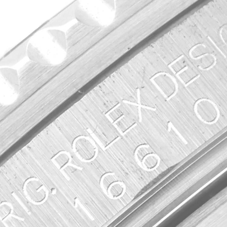 This is a close-up image showing the engraved details on the side of a Rolex Submariner 16610 Men
s Stainless Steel Black Dial 16610 Men
s Stainless Steel Black Dial watch case and bezel.