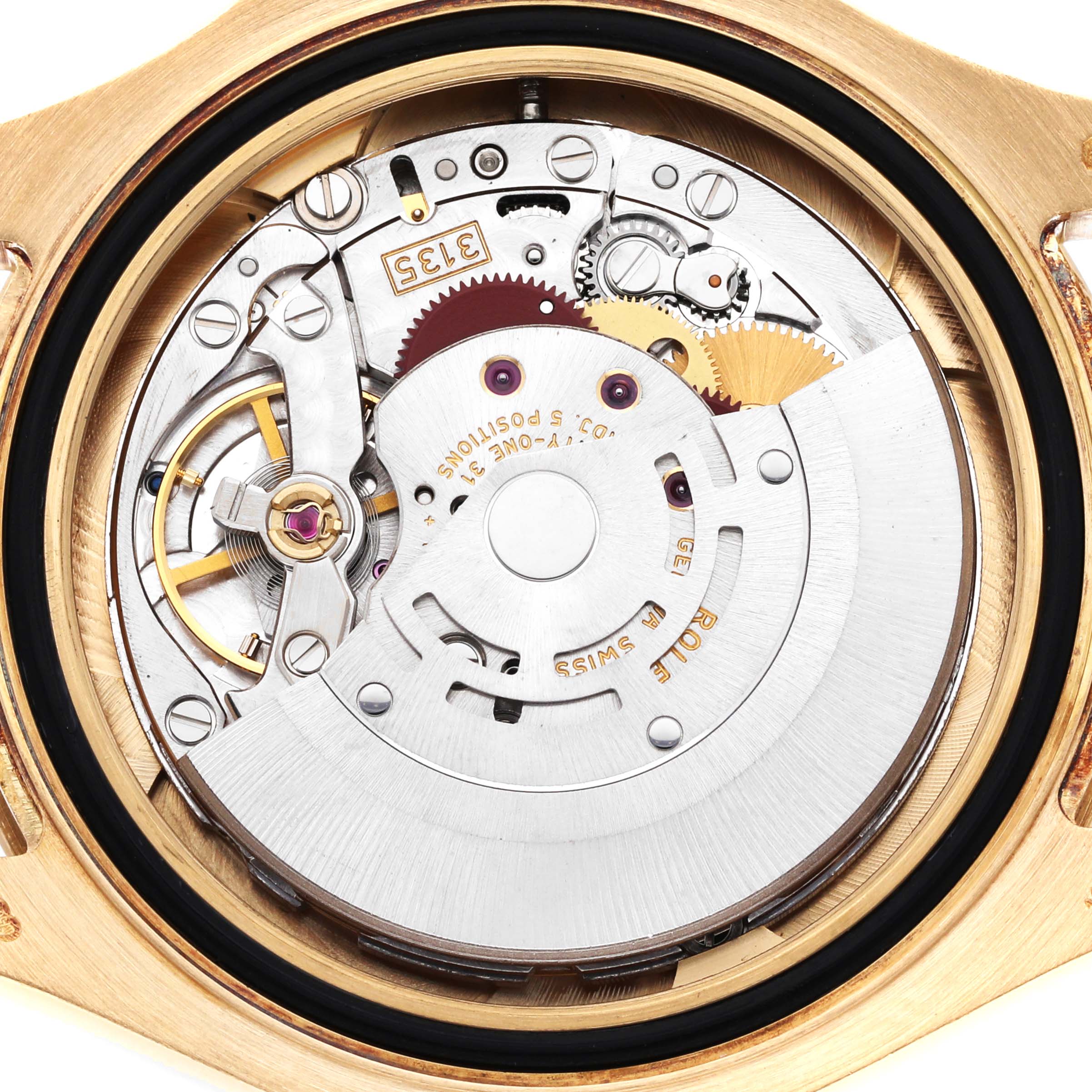 The image shows the open case back of a Rolex Turn-o-Graph, highlighting the movement and internal mechanisms.