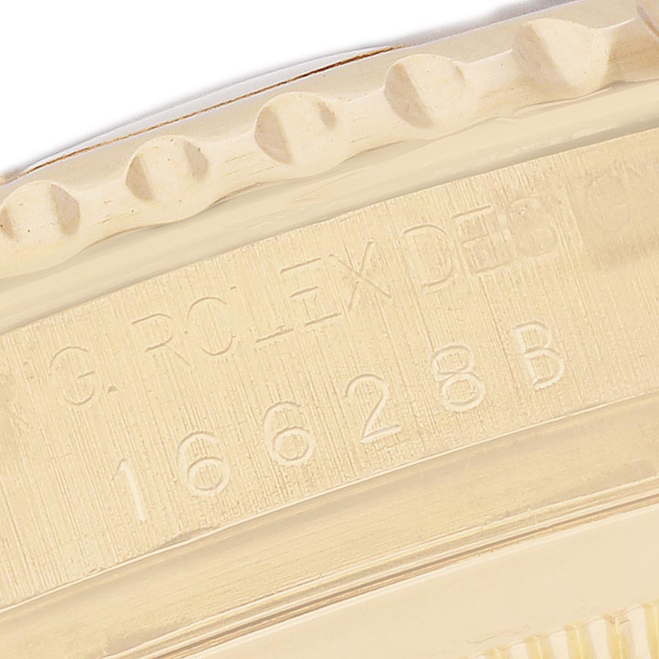 The image shows a close-up of the bezel and engraved model number of a Rolex Yacht-Master 16628 Men's Yellow Gold Mother of Pearl Dial 16628 Men's Yellow Gold Mother of Pearl Dial watch.