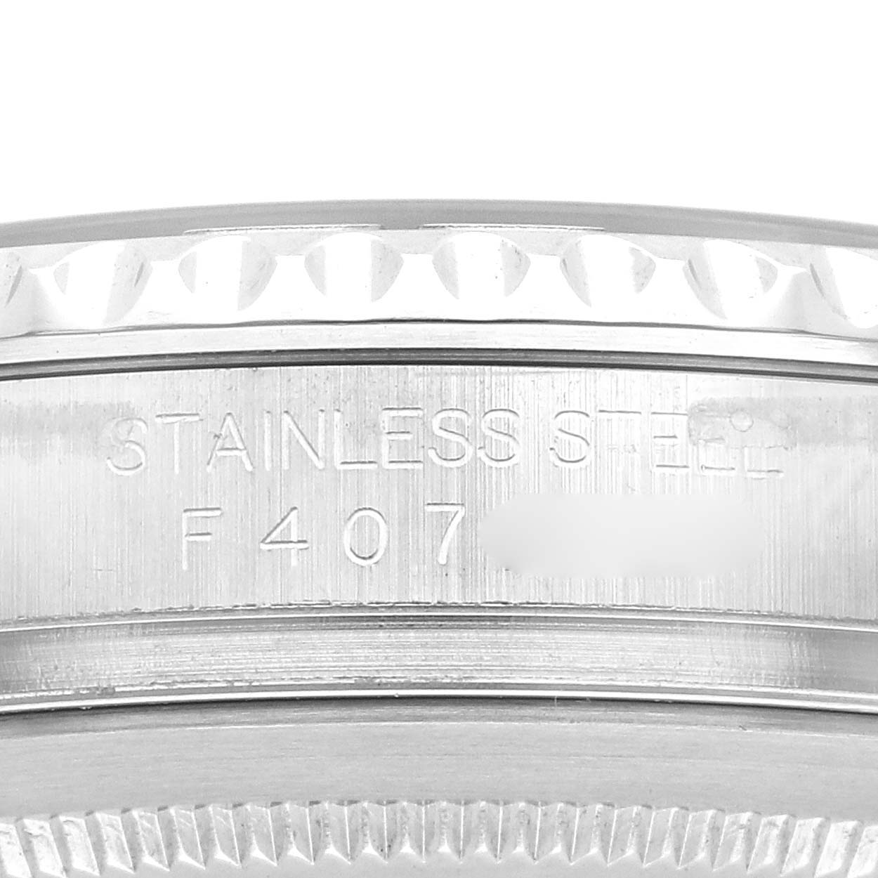 The image shows the edge of the Rolex Yacht-Master 16622 Men's Stainless Steel Silver Dial 16622 Men's Stainless Steel Silver Dial watch, highlighting its stainless steel case with engraved details.
