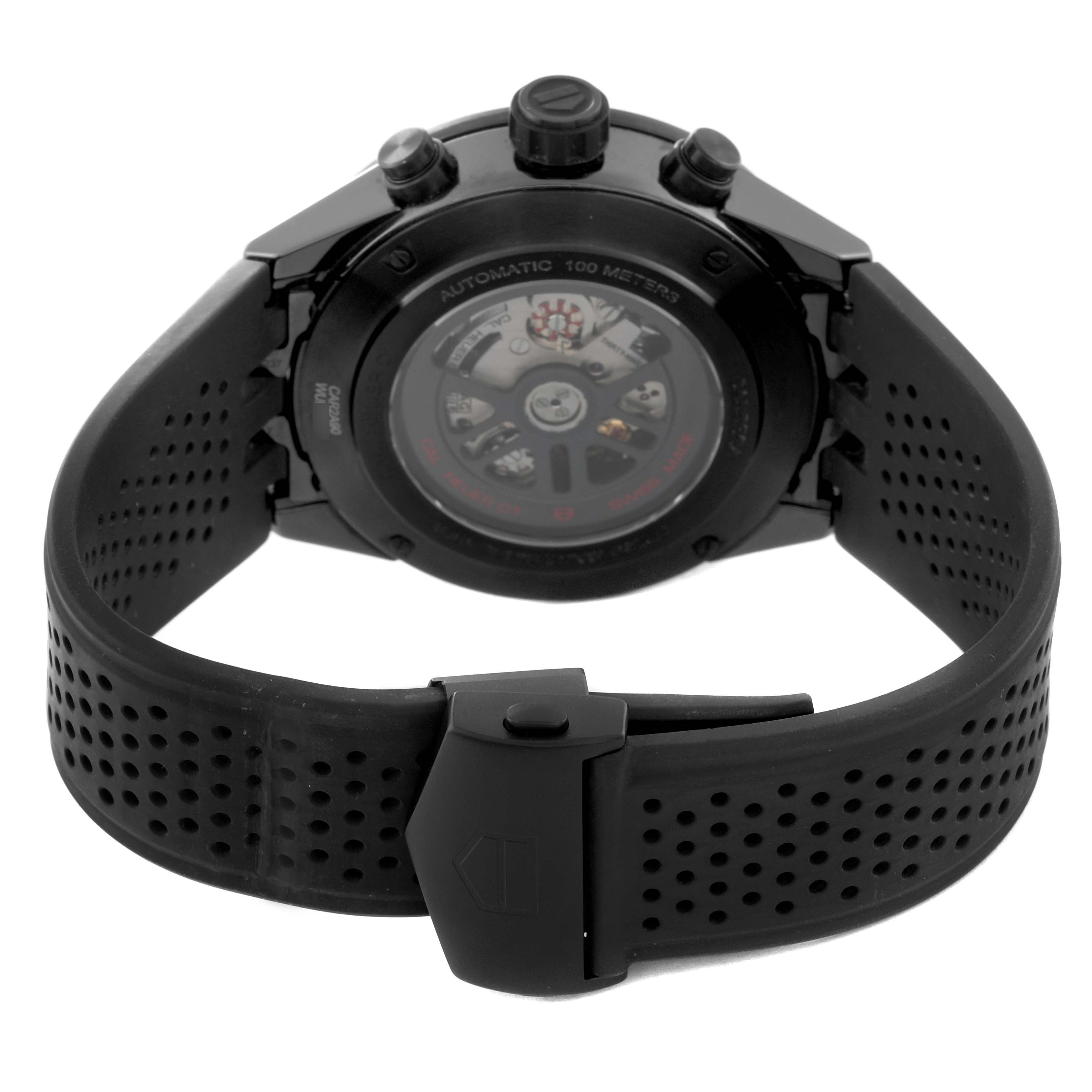 The image shows the back view of a Tag Heuer Carrera CAR2A90.FT6071 Men's Ceramic Transparent Dial CAR2A90.FT6071 Men's Ceramic Transparent Dial watch, focusing on the automatic movement and black perforated strap.