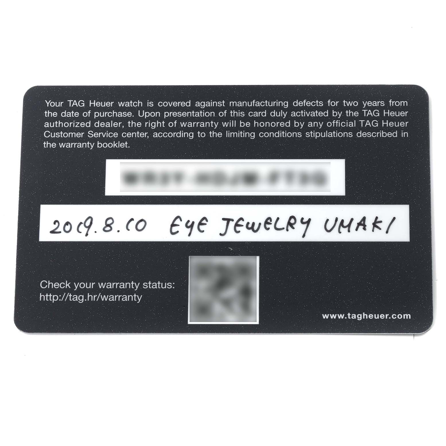 This is a close-up of a warranty card for a Tag Heuer Carrera CAR2A90.FT6071 Men's Ceramic Transparent Dial CAR2A90.FT6071 Men's Ceramic Transparent Dial model watch.