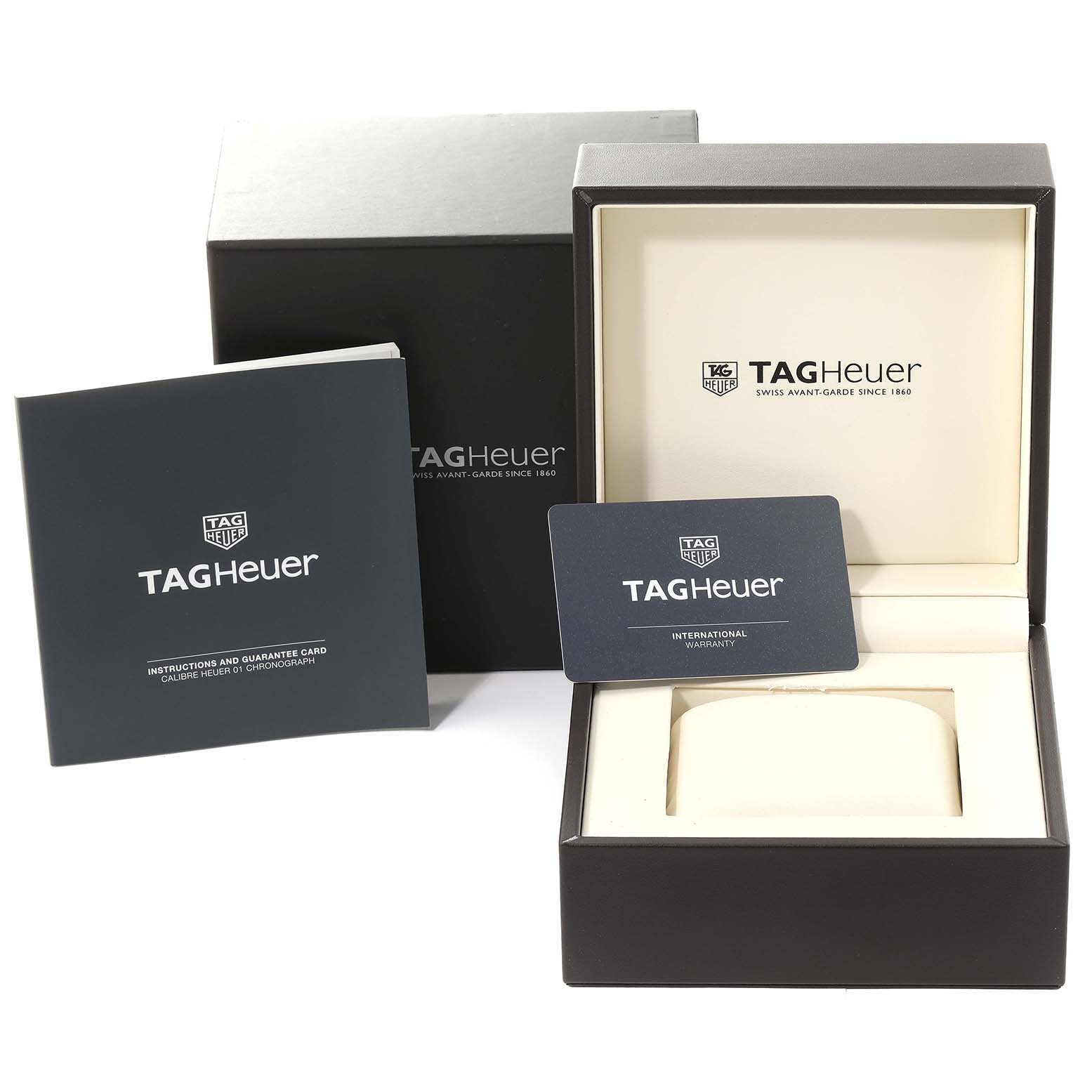 The image shows the box, international warranty card, and instruction manual for the Carrera model by Tag Heuer.