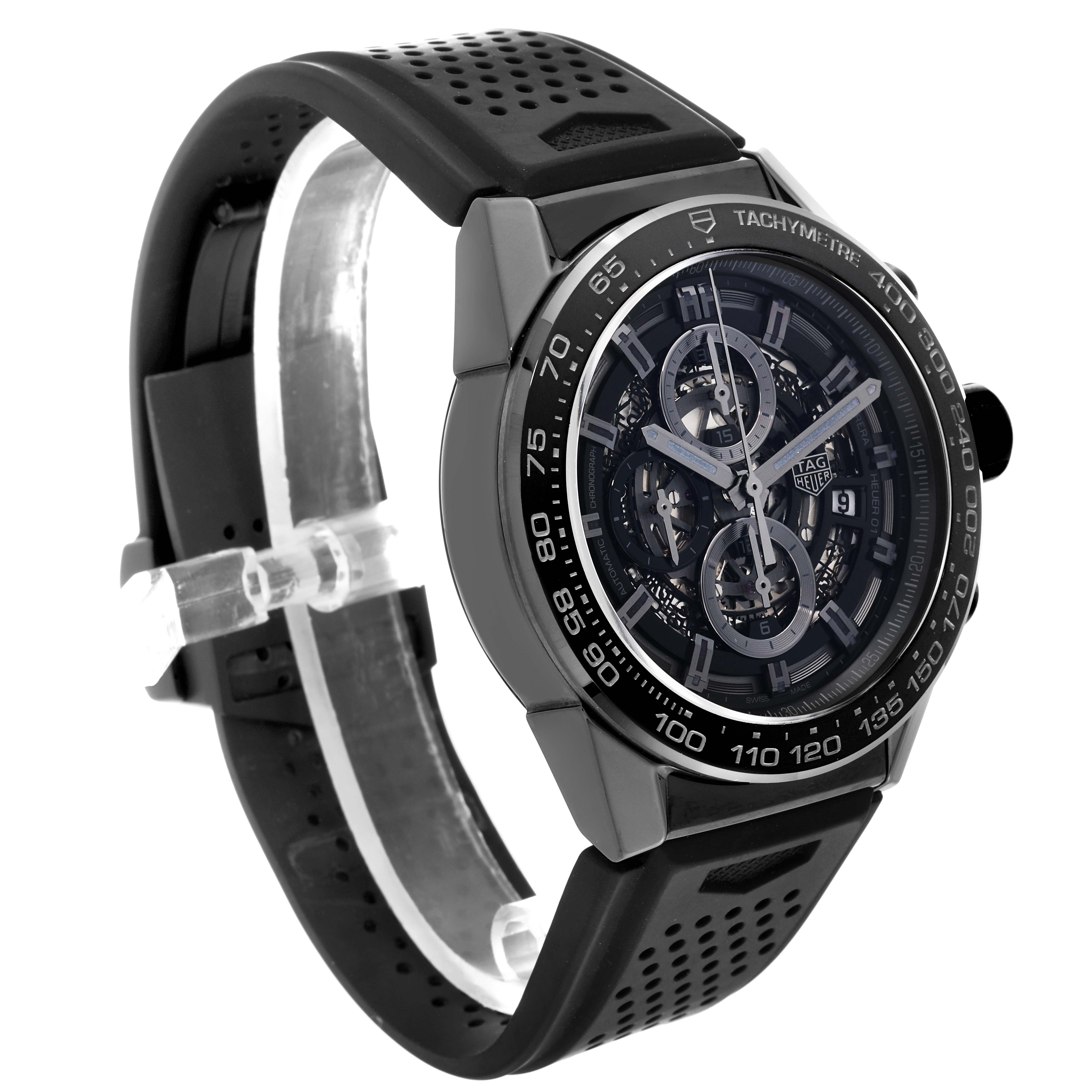 This image shows a Tag Heuer Carrera CAR2A90.FT6071 Men's Ceramic Transparent Dial CAR2A90.FT6071 Men's Ceramic Transparent Dial watch at an oblique angle, highlighting its dial, case, and perforated black strap.