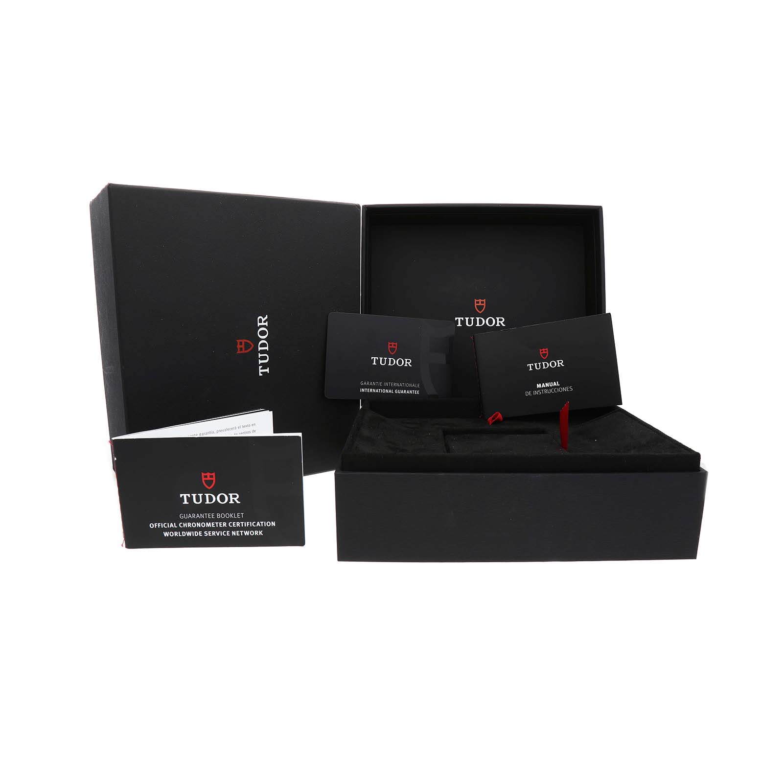 The image shows the Tudor Heritage Black Bay 79830RB Men's Stainless Steel Black Dial watch box and documents, including manuals and guarantee cards.