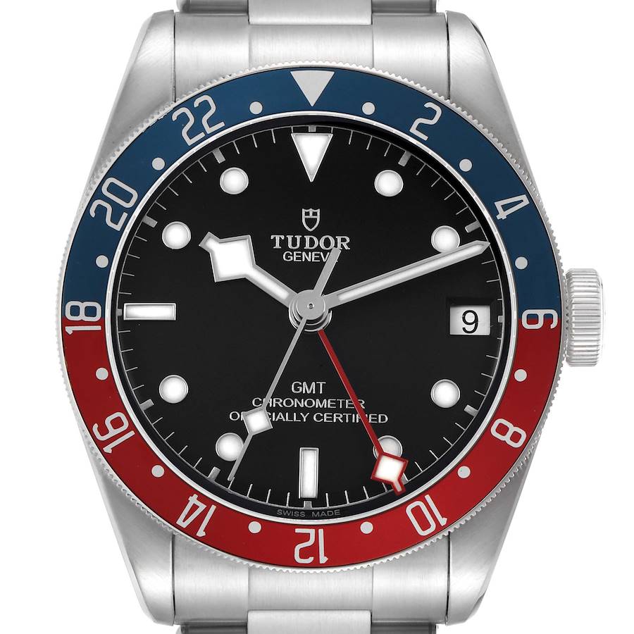 The Tudor Heritage Black Bay 79830RB Men's Stainless Steel Black Dial watch is shown from the front, displaying its black dial, red and blue bezel, and silver hands.