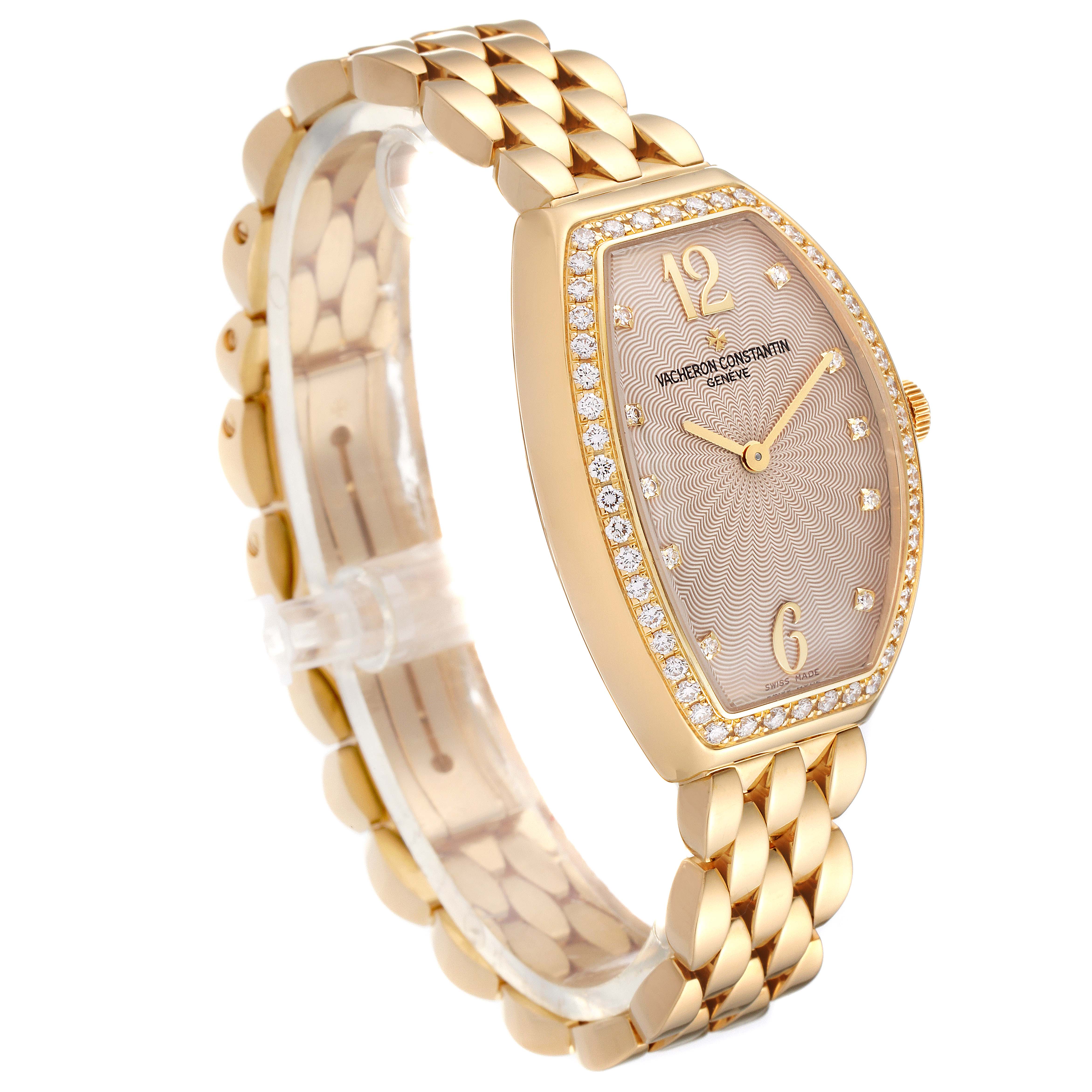 The image shows a side-angle view of the Vacheron Constantin Egerie 25540/344J Women
s Rose Gold Silver Dial 25540/344J Women
s Rose Gold Silver Dial watch, highlighting its golden bracelet, diamond-encrusted bezel, and textured dial.