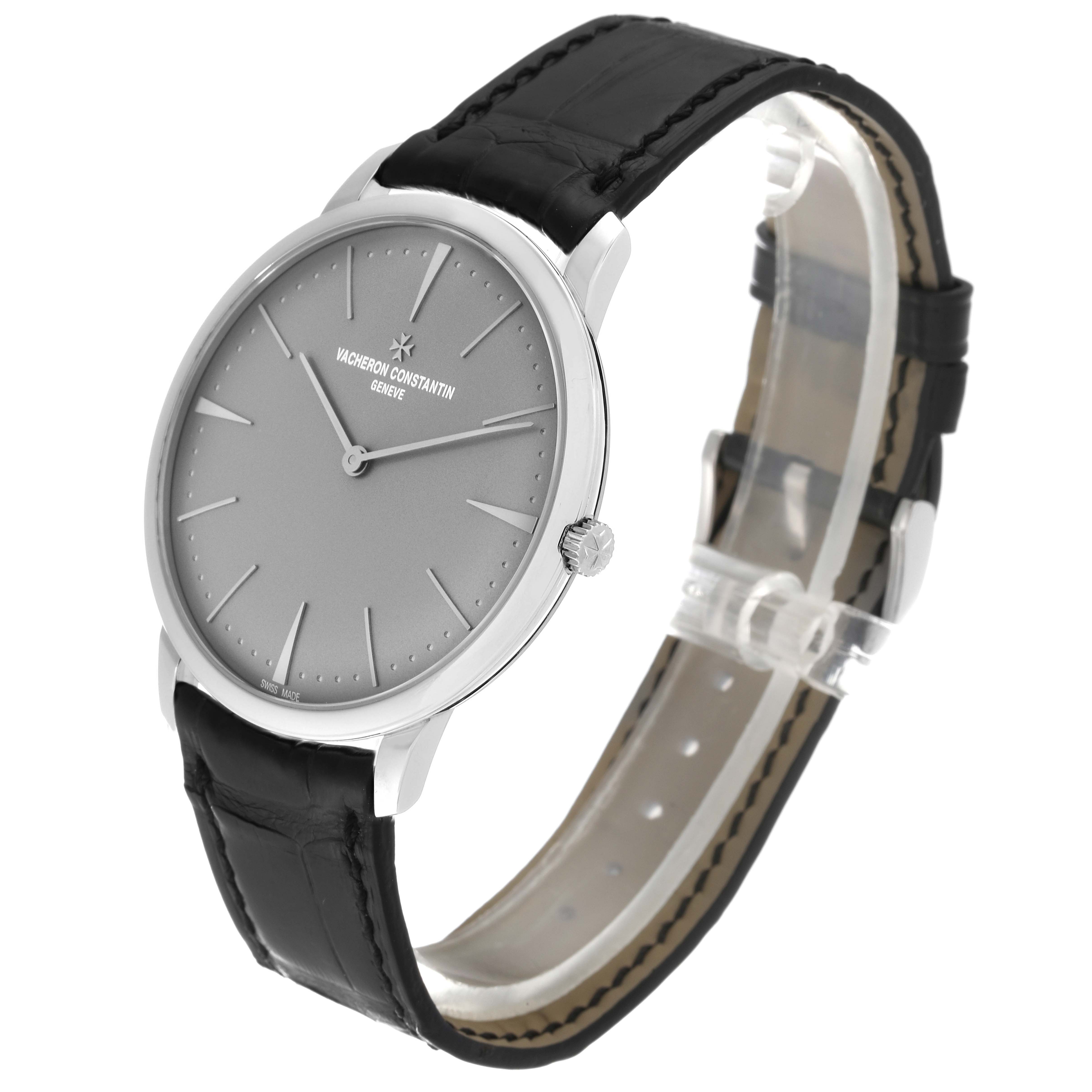 This image shows a Vacheron Constantin Patrimony 81180/000P-9539 Men's Platinum Grey Dial 81180/000P-9539 Men's Platinum Grey Dial watch at an angle highlighting the face, crown, and leather strap.