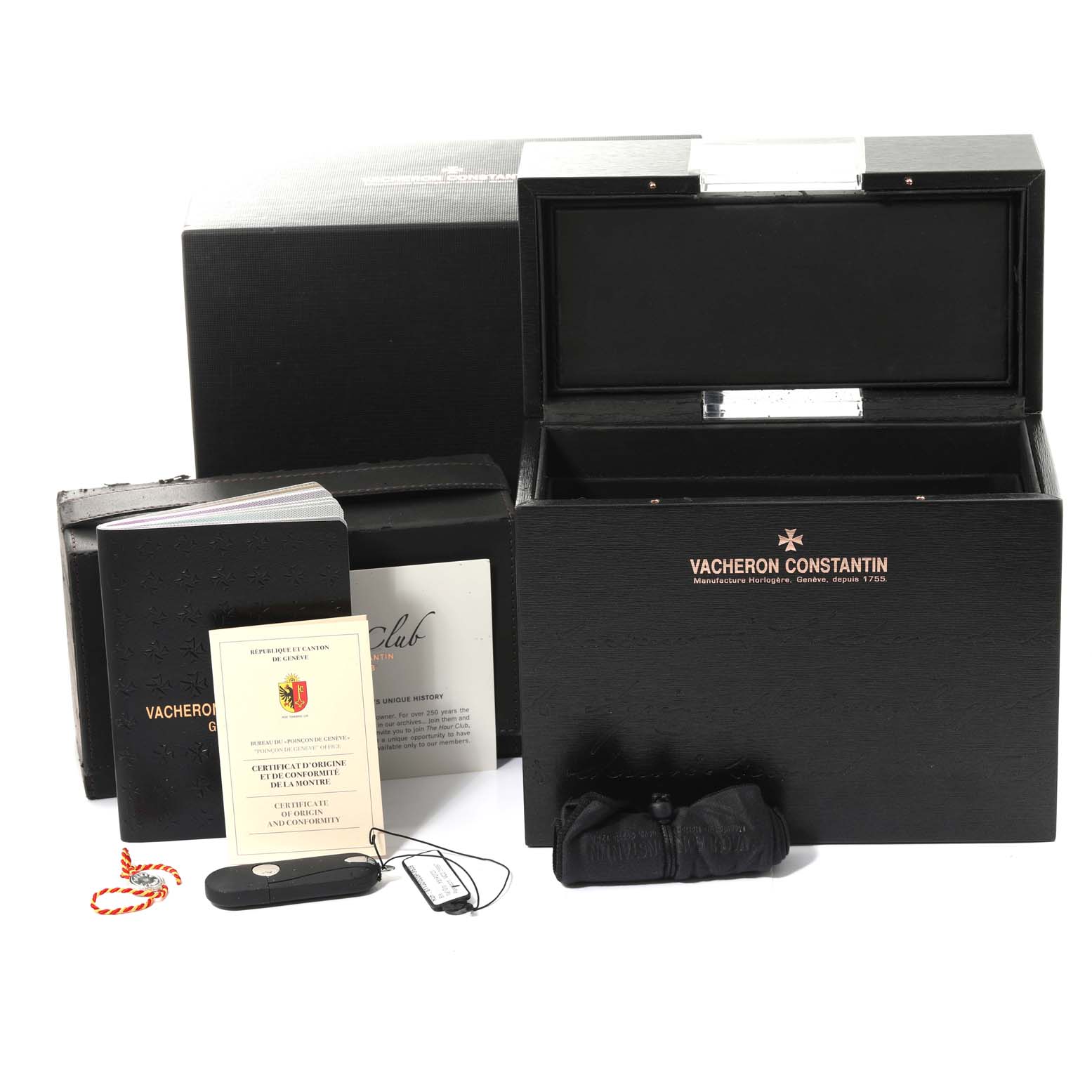 The image shows the open presentation box, booklet, certificate, and accessories for the Patrimony model by Vacheron Constantin.