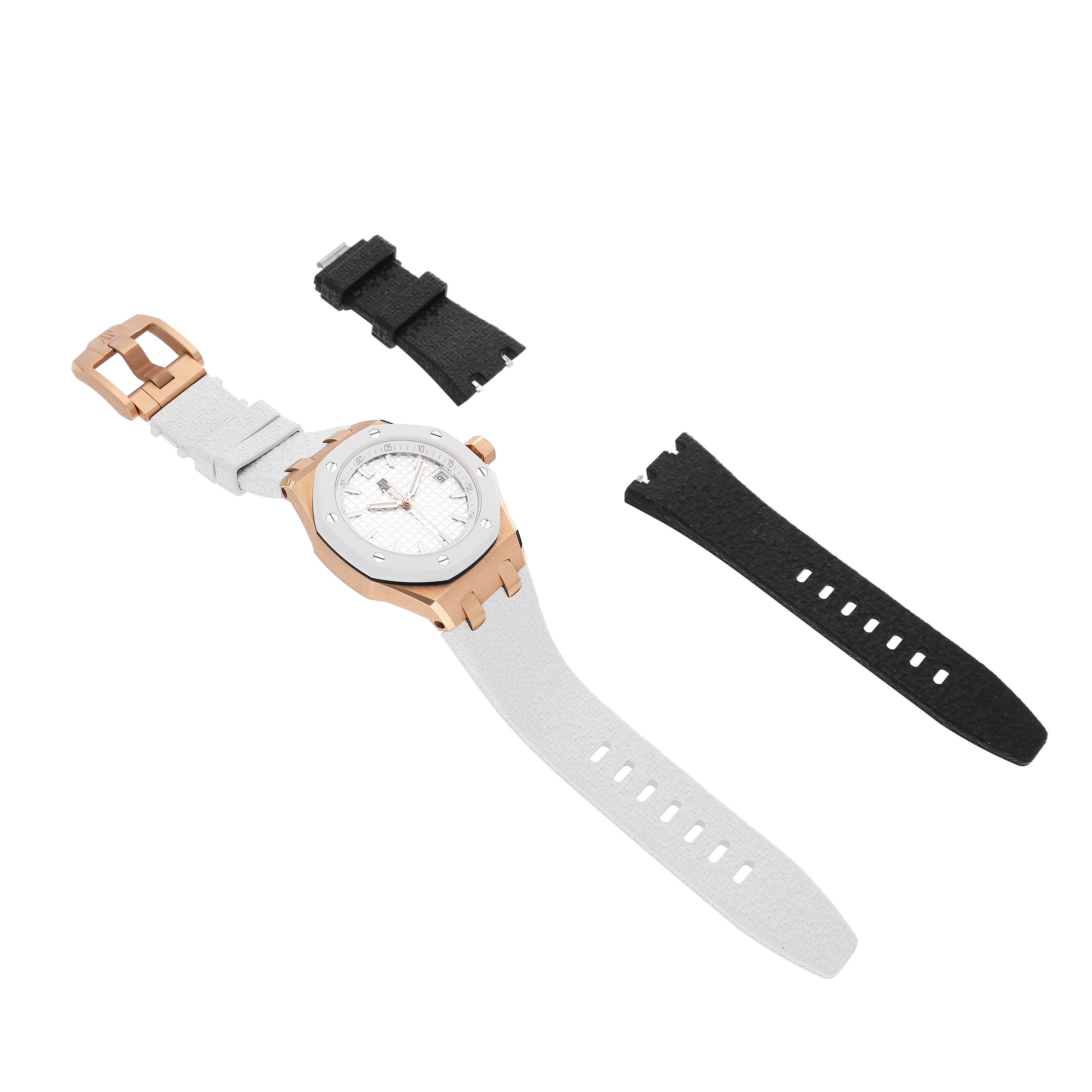 The Audemars Piguet Royal Oak Offshore 77605OK.OO.A101CA.01 Women's Rose Gold White Dial watch is shown from a top view, featuring a rose gold case, with white and black interchangeable straps.