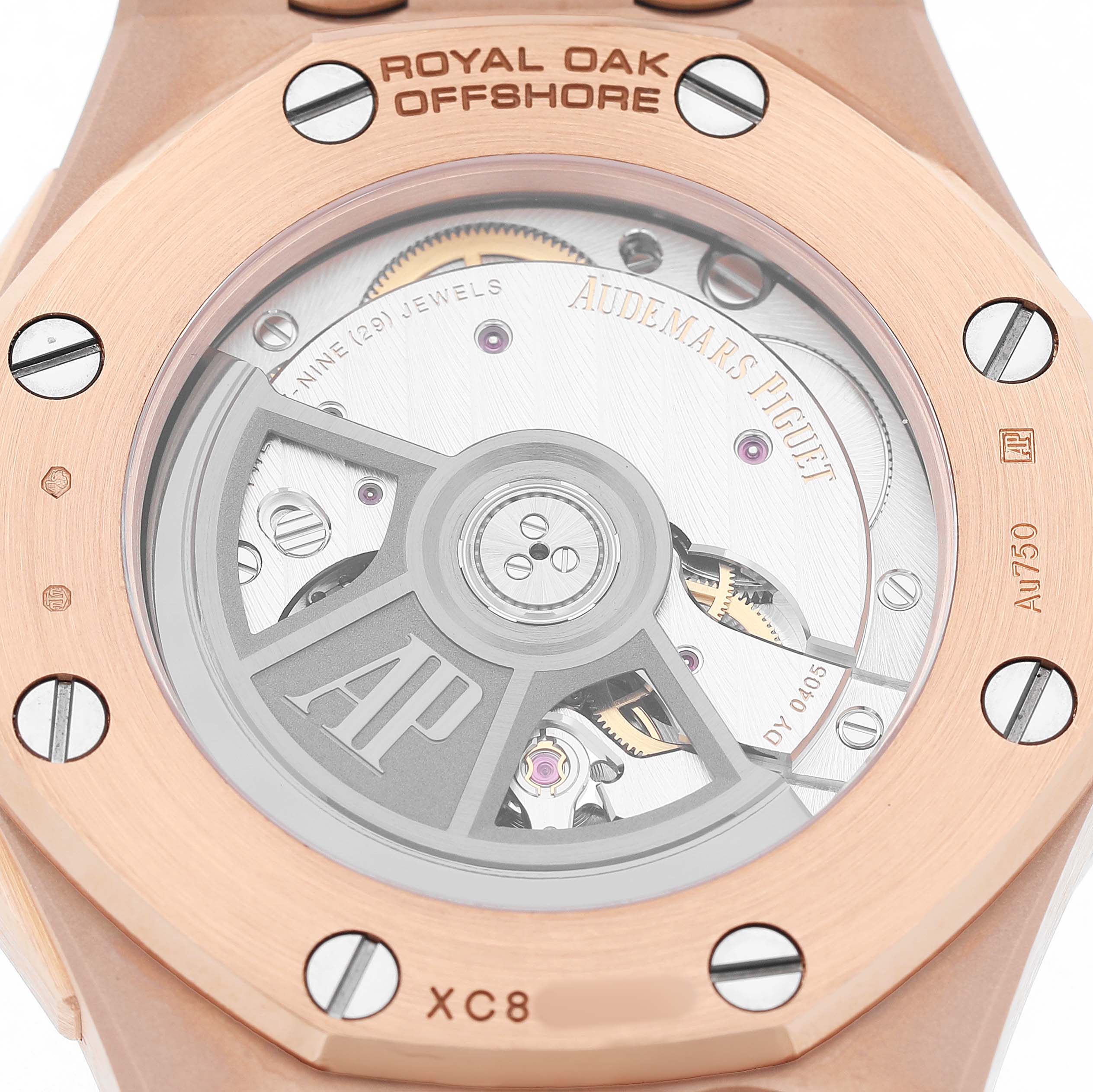 The image shows the back of an Audemars Piguet Royal Oak Offshore 77605OK.OO.A101CA.01 Women's Rose Gold White Dial, highlighting the movement and rotor.