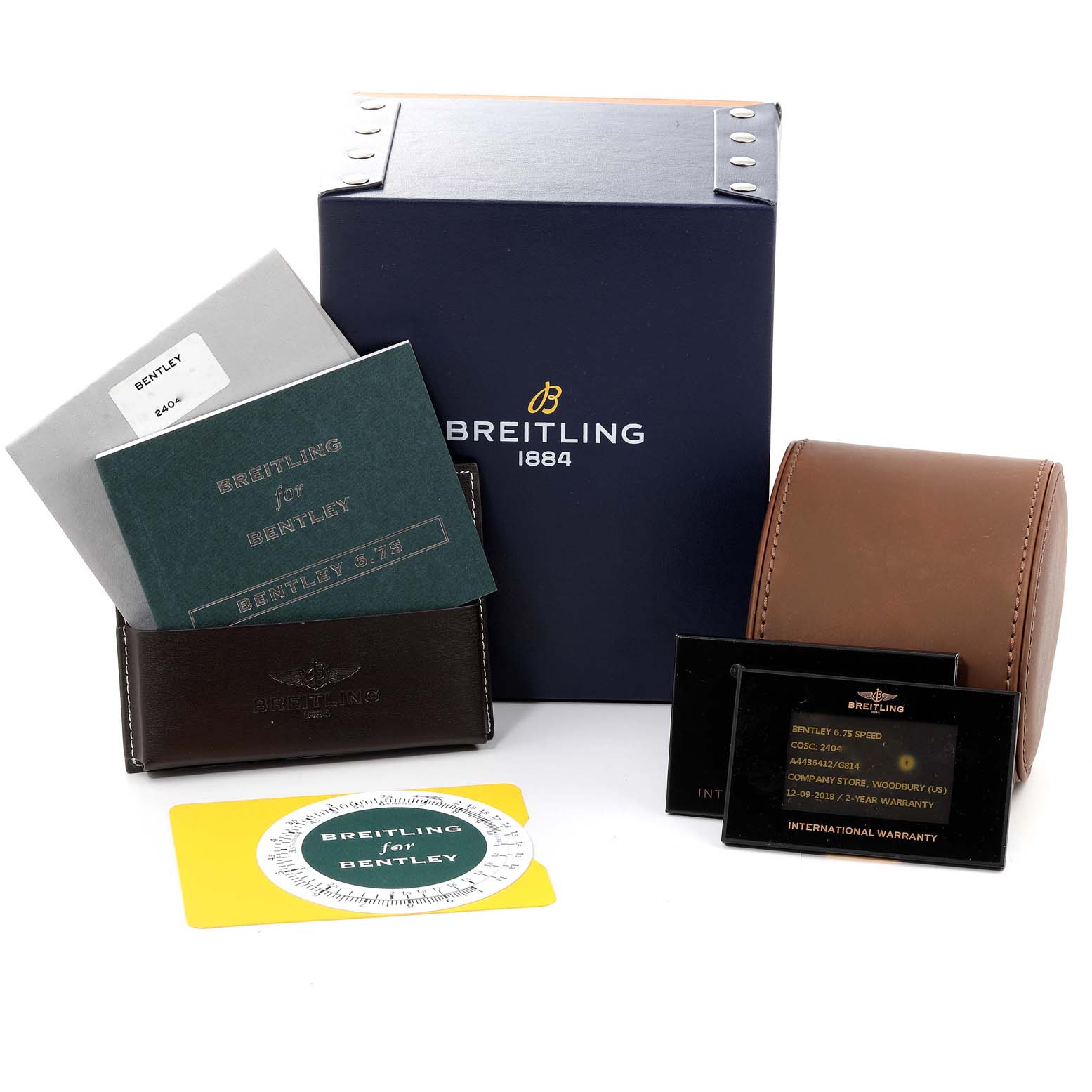 The image shows accessories for a Breitling Bentley A44364 Men's Stainless Steel Silver Dial A44364 Men's Stainless Steel Silver Dial watch, including a box, manuals, a case, and warranty cards.