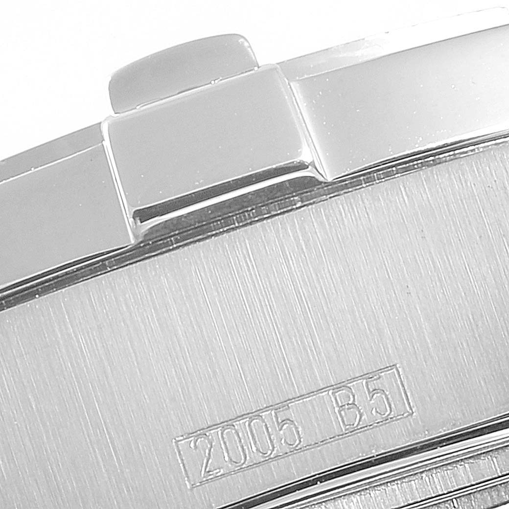 This image shows the corner of the case and part of the bracelet of a Colt model by Breitling.