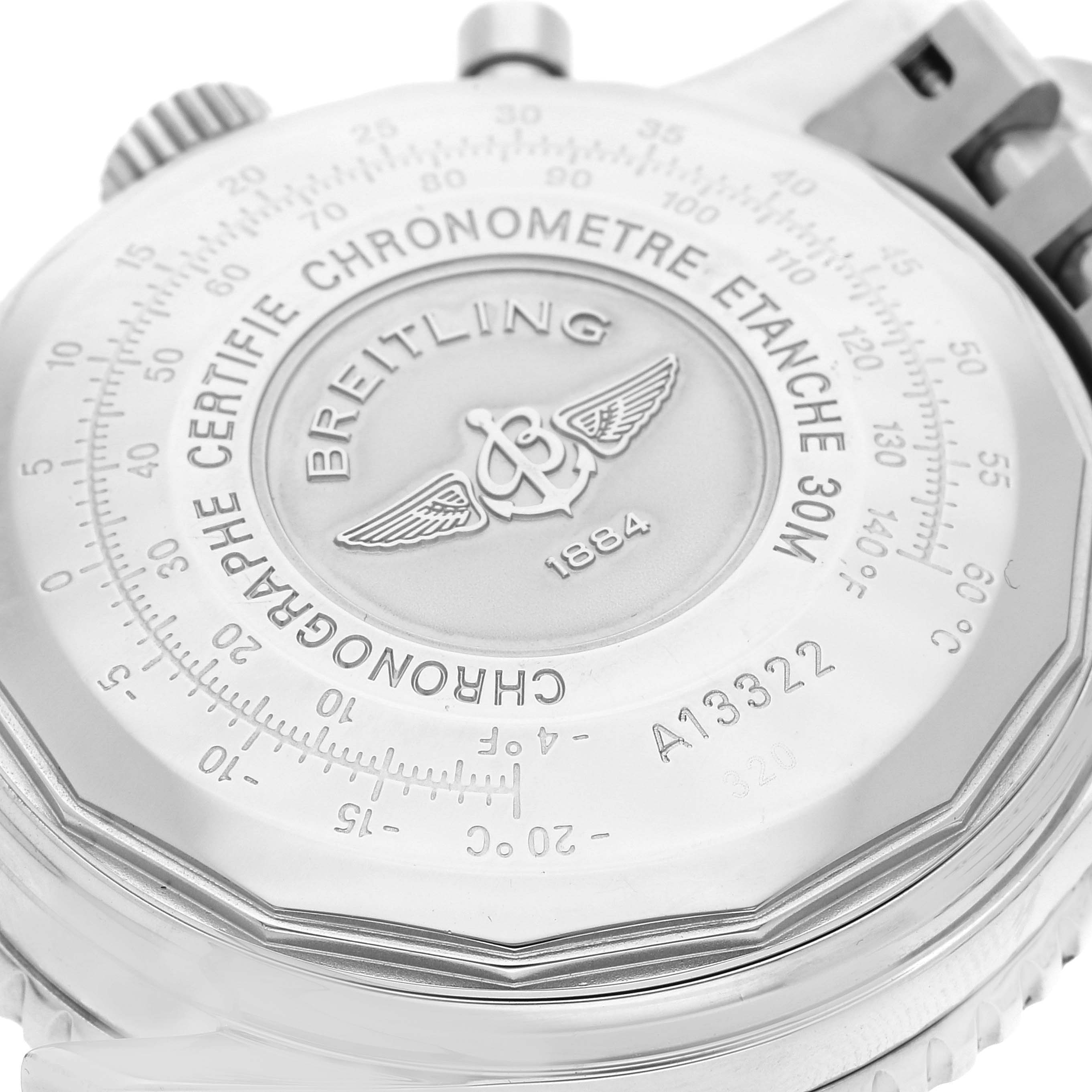 The image shows the back case of a Breitling Navitimer A13322 Men
s Stainless Steel Blue Dial A13322 Men
s Stainless Steel Blue Dial watch, highlighting its engravings and certifications.