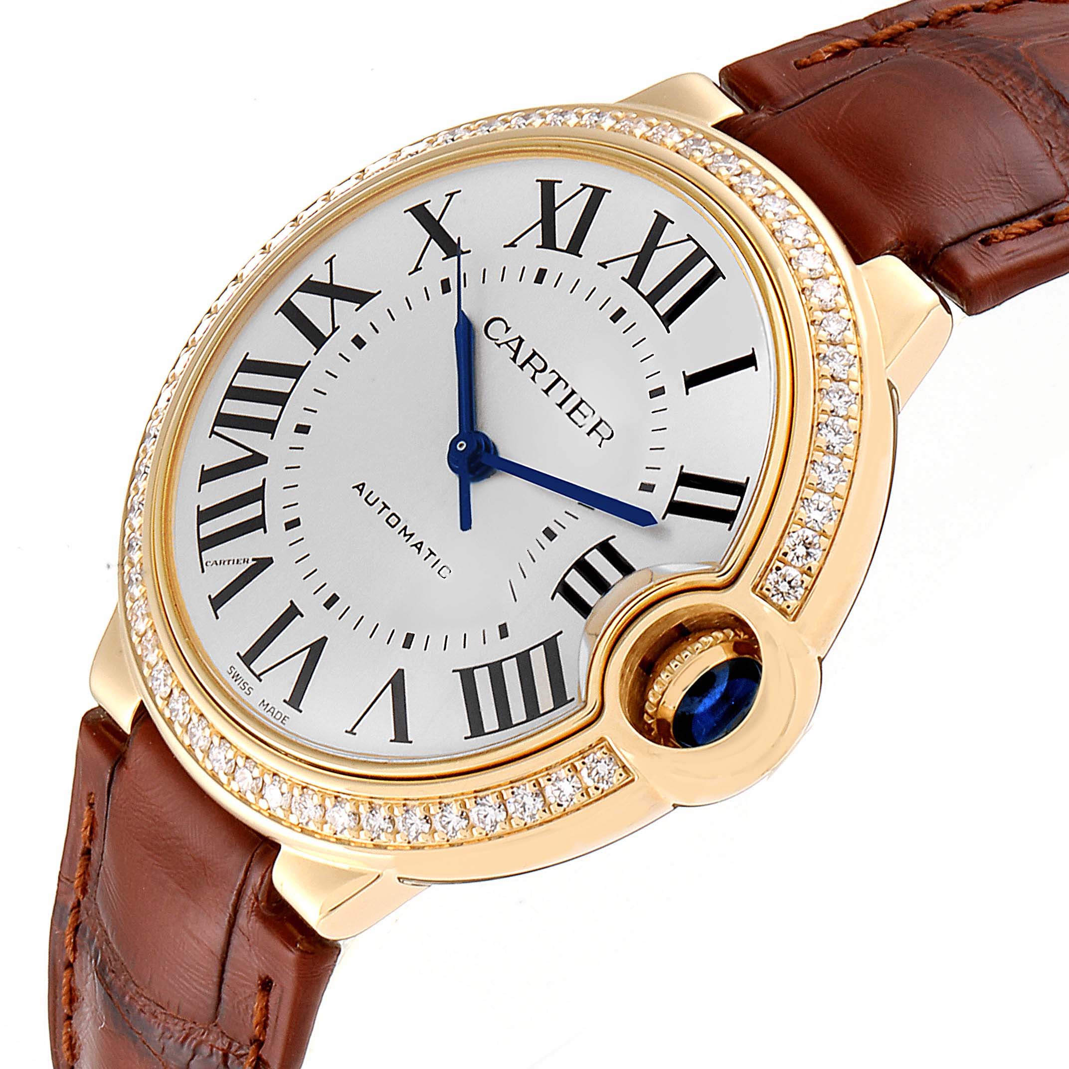 The image shows a close-up, angled view of the Cartier Ballon Bleu WE900451 Women
s Yellow Gold Silver Dial WE900451 Women
s Yellow Gold Silver Dial watch, highlighting its dial, Roman numerals, and leather strap.
