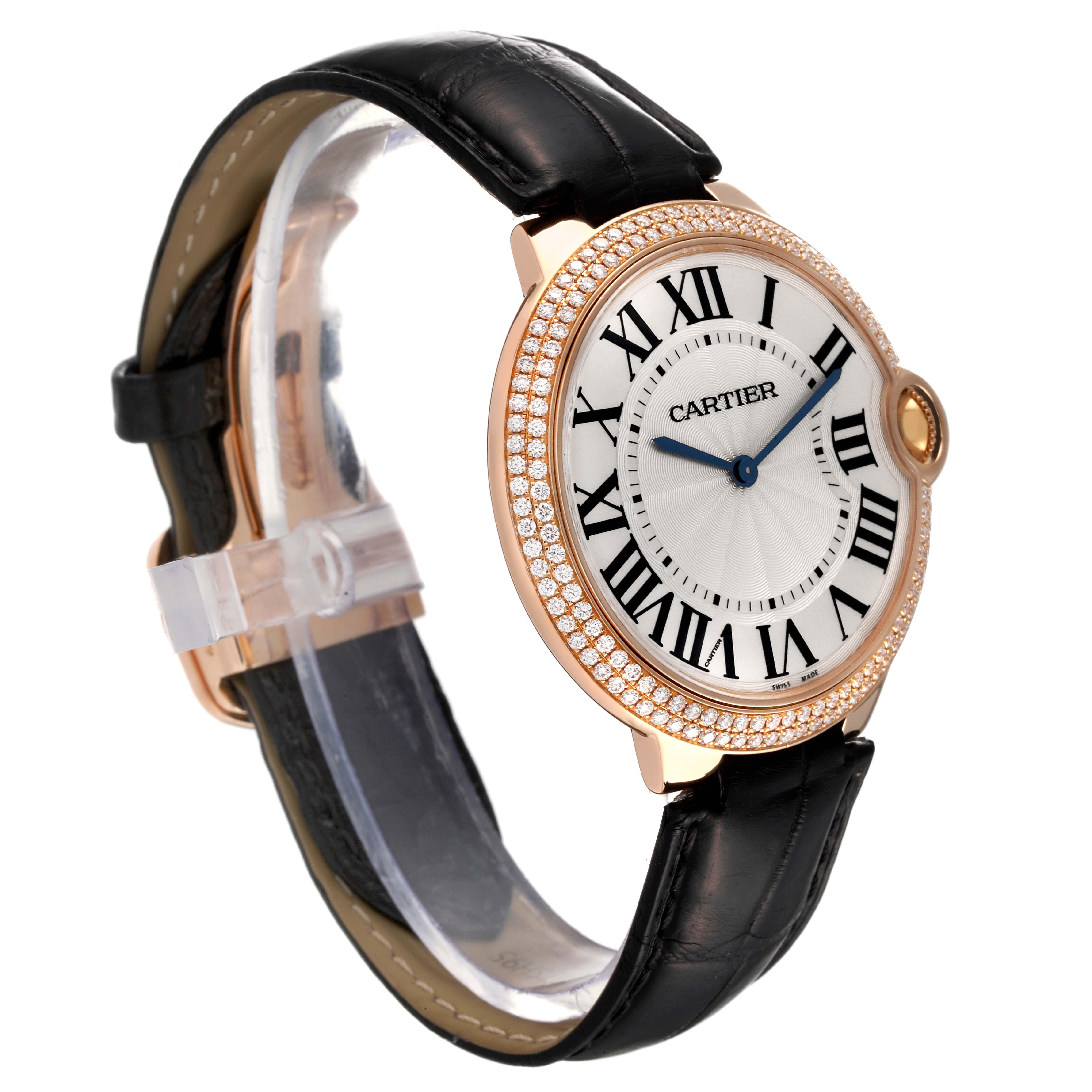 The image shows a Cartier Ballon Bleu WE902055 Men
s Rose Gold Silver Dial WE902055 Men
s Rose Gold Silver Dial watch at a three-quarter angle, highlighting the face, bezel, and strap.