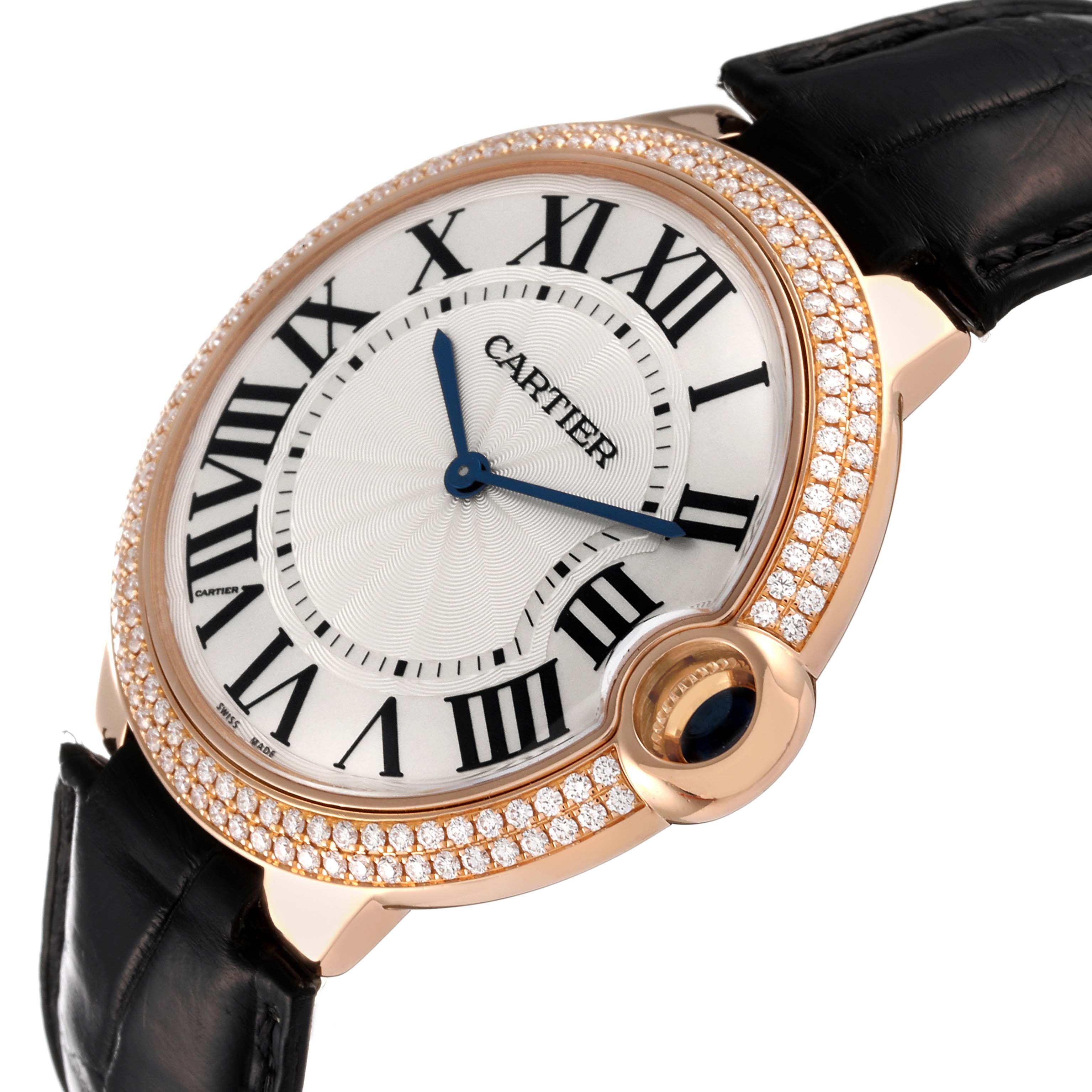 The image shows a close-up, angled view of the Cartier Ballon Bleu WE902055 Men
s Rose Gold Silver Dial WE902055 Men
s Rose Gold Silver Dial watch, highlighting its face, bezel, and part of the black strap.