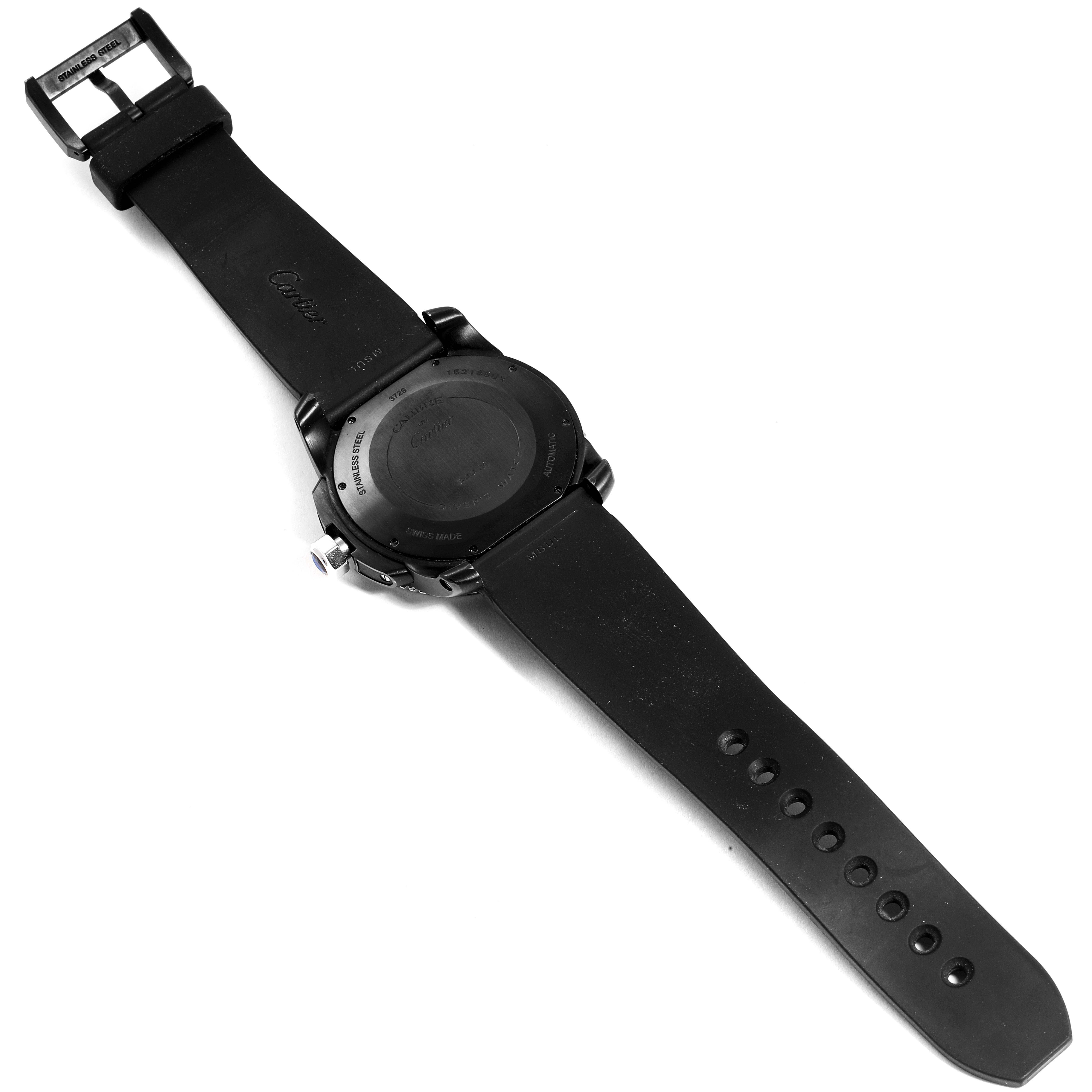 The image shows the back of a Calibre de Cartier watch by Cartier, including its case back, strap, and buckle.