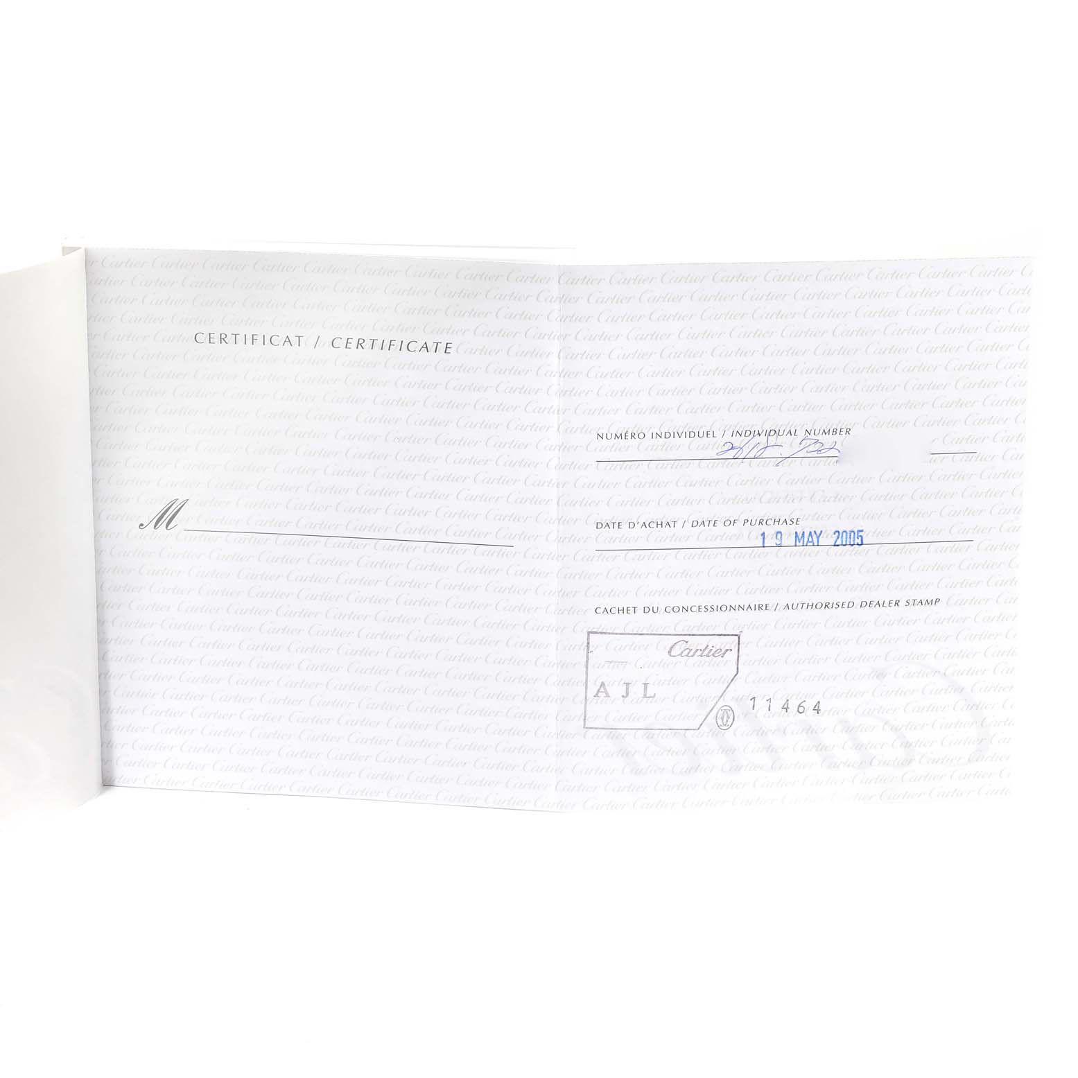 This image shows a certificate booklet for the Cartier Roadster W62027Z1 Men
s Steel and Gold (two tone) Silver Dial W62027Z1 Men
s Steel and Gold (two tone) Silver Dial watch, displaying purchase details and dealer information.
