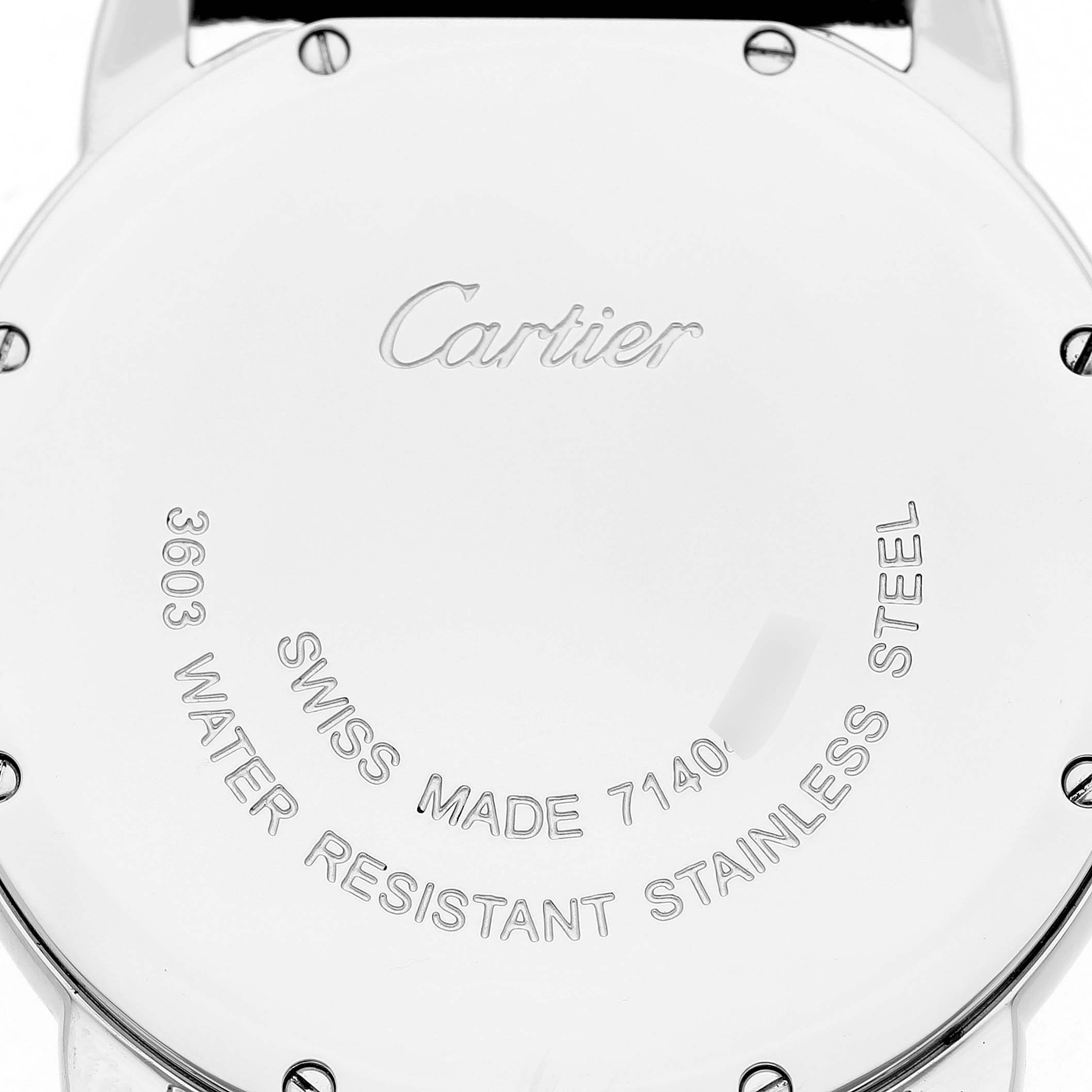 The image shows the back of a Cartier Ronde W6701005 Men's Stainless Steel Silver Dial watch, highlighting engravings and screws.