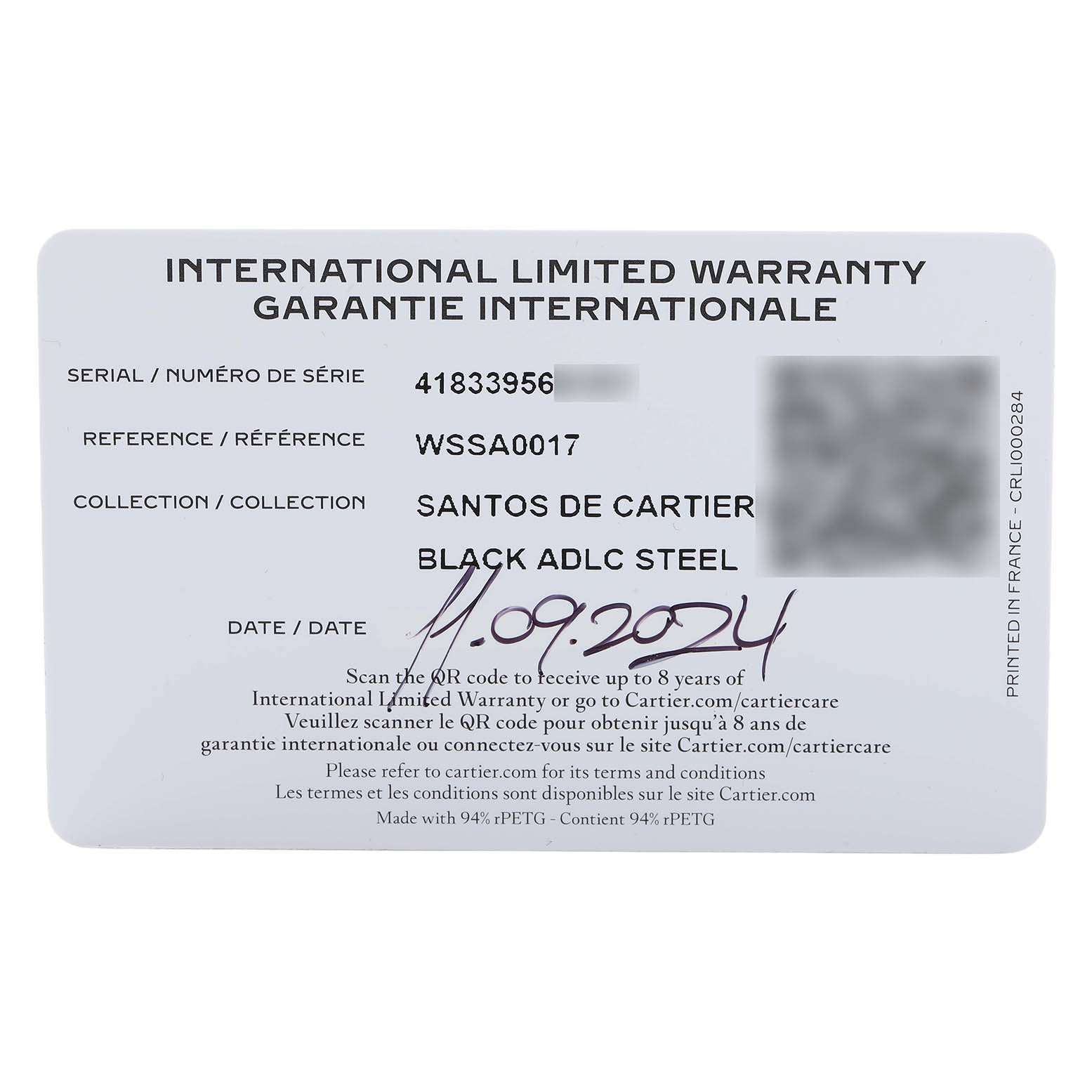 The image shows an international limited warranty card for the Santos de Cartier watch.